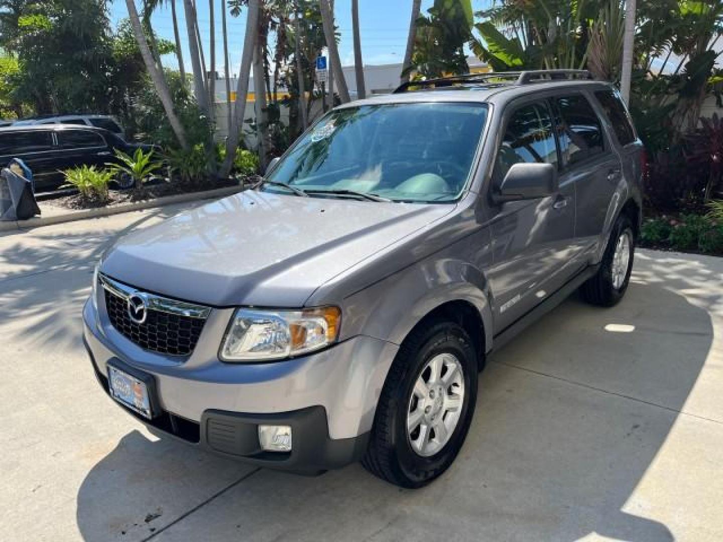 2008 Monterey Gray /Dark Chocolate Mazda Tribute AWD 1 Sport LOW MILES 65,165 (4F2CZ96128K) with an 3.0L DOHC SMPI 24-Valve V6 Engine engine, Automatic transmission, located at 4701 North Dixie Hwy, Pompano Beach, FL, 33064, (954) 422-2889, 26.240938, -80.123474 - 2008 MAZDA TRIBUTE S SPORT AWD NEW $ 30,787 ROAD READY VIN: 4F2CZ96128KM10354 NO RECALLS 4X4 AWD 4 DOOR WAGON/SPORT UTILITY POWER SEATS POWER MIRRORS 3.0L V6 F DOHC 24V LOW MILES 65,165 GASOLINE 1 OWNER POWER SUNROOF FRONT WHEEL DRIVE W/ 4X4 25 SERVICE RECORDS AWD Anti-Theft System Braking Assist Cr - Photo#3