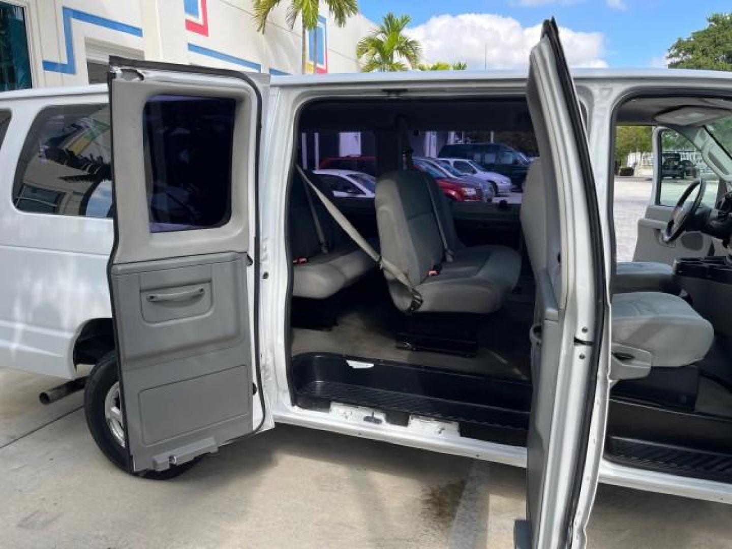 2008 Oxford White /Medium Flint Ford Econoline Wagon E 350 15 XLT LOW MILES 65,995 (1FBSS31L98D) with an 5.4L EFI V8 Engine engine, Automatic transmission, located at 4701 North Dixie Hwy, Pompano Beach, FL, 33064, (954) 422-2889, 26.240938, -80.123474 - 2008 FORD E-SERIES E-350 SD XLT 15 ROAD READY 5,4L V8 VIN: 1FBSS31L98DA44990 NO RECALLS VAN 15 PASSENGER 5.4L V8 F SOHC 16V LOW MILES 65,995 GASOLINE 2 SERVICE RECORDS REAR WHEEL DRIVE POWER MIRRORS ABS Brakes AM/FM Stereo Air Conditioning Automatic Transmission CD Audio Cloth Seats Cruise Control F - Photo#13