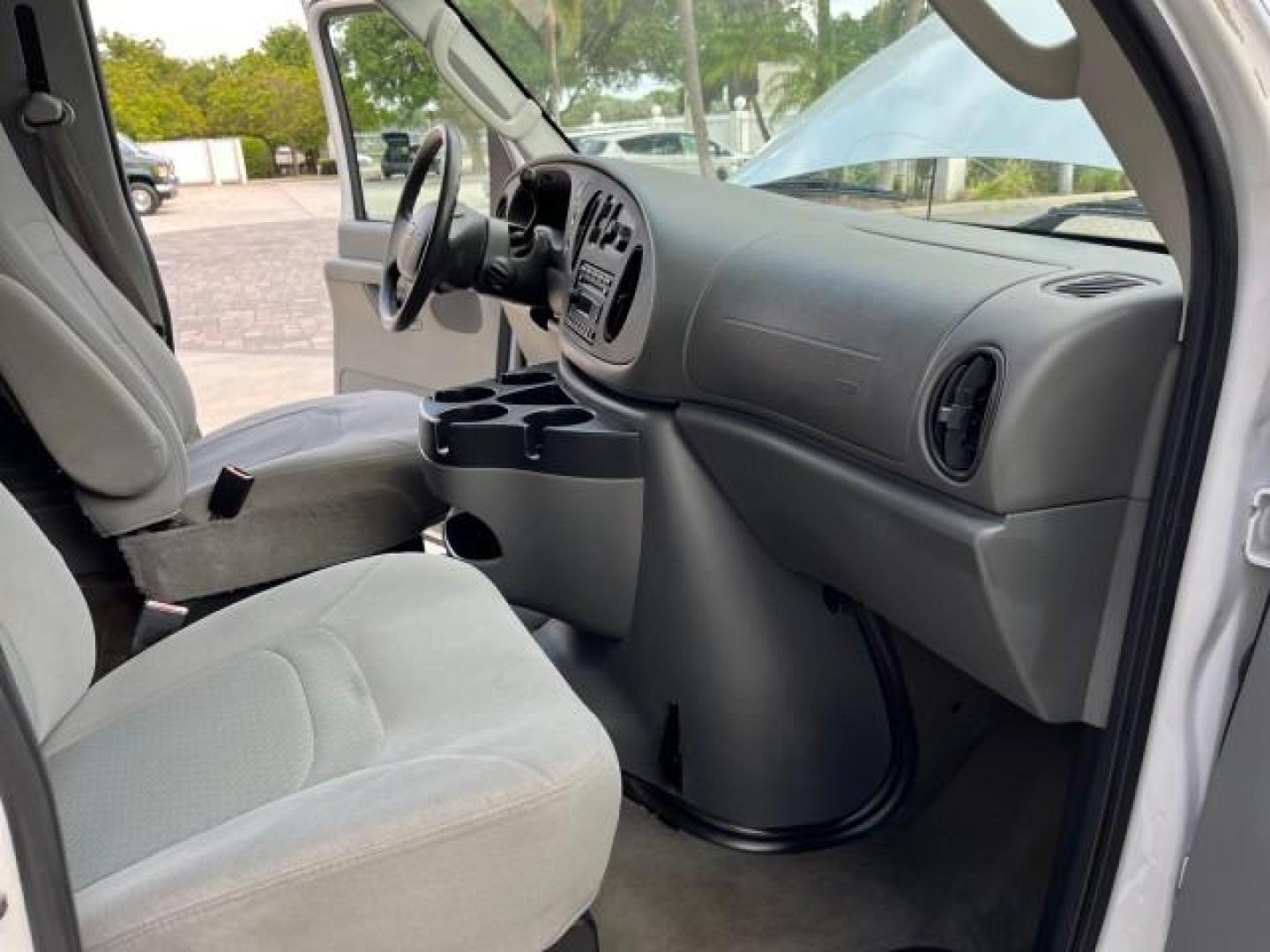 2008 Oxford White /Medium Flint Ford Econoline Wagon E 350 15 XLT LOW MILES 65,995 (1FBSS31L98D) with an 5.4L EFI V8 Engine engine, Automatic transmission, located at 4701 North Dixie Hwy, Pompano Beach, FL, 33064, (954) 422-2889, 26.240938, -80.123474 - 2008 FORD E-SERIES E-350 SD XLT 15 ROAD READY 5,4L V8 VIN: 1FBSS31L98DA44990 NO RECALLS VAN 15 PASSENGER 5.4L V8 F SOHC 16V LOW MILES 65,995 GASOLINE 2 SERVICE RECORDS REAR WHEEL DRIVE POWER MIRRORS ABS Brakes AM/FM Stereo Air Conditioning Automatic Transmission CD Audio Cloth Seats Cruise Control F - Photo#26