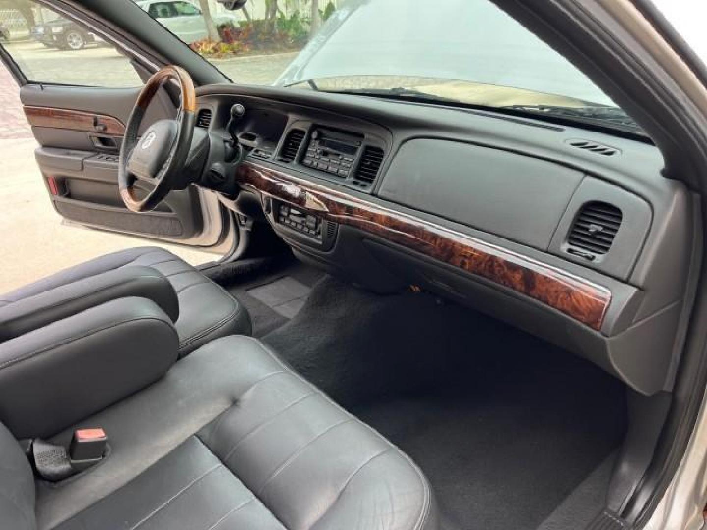 2004 Silver Birch Metallic /Light Flint Mercury Grand Marquis LS Ultimate LOW MILES 46,888 (2MEFM75W44X) with an 4.6L SOHC SEFI V8 Engine engine, Automatic transmission, located at 4701 North Dixie Hwy, Pompano Beach, FL, 33064, (954) 422-2889, 26.240938, -80.123474 - 2004 MERCURY GRAND MARQUIS LS PREMIUM NEW $ 33,310 ROAD READY VIN: 2MEFM75W44X662836 FLORIDA OWNER 4.6L V8 SEDAN 4 DR NO ACCIDENTS 3 SERV REC 4.6L V8 F DOHC POWER HEATED LEATHER SEATS GASOLINE POWER HEATED MIRRORS REAR WHEEL DRIVE LOW MILES 46,888 LS PREMIUM Alloy Wheels Approach Lights Auto-dimming - Photo#26