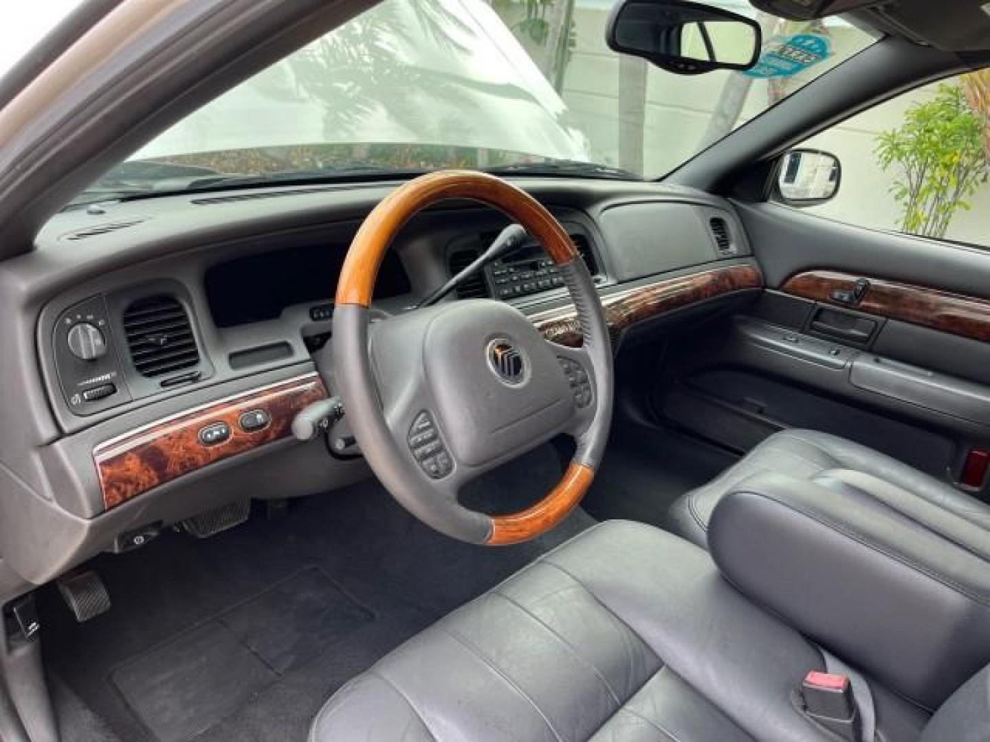 2004 Silver Birch Metallic /Light Flint Mercury Grand Marquis LS Ultimate LOW MILES 46,888 (2MEFM75W44X) with an 4.6L SOHC SEFI V8 Engine engine, Automatic transmission, located at 4701 North Dixie Hwy, Pompano Beach, FL, 33064, (954) 422-2889, 26.240938, -80.123474 - 2004 MERCURY GRAND MARQUIS LS PREMIUM NEW $ 33,310 ROAD READY VIN: 2MEFM75W44X662836 FLORIDA OWNER 4.6L V8 SEDAN 4 DR NO ACCIDENTS 3 SERV REC 4.6L V8 F DOHC POWER HEATED LEATHER SEATS GASOLINE POWER HEATED MIRRORS REAR WHEEL DRIVE LOW MILES 46,888 LS PREMIUM Alloy Wheels Approach Lights Auto-dimming - Photo#35