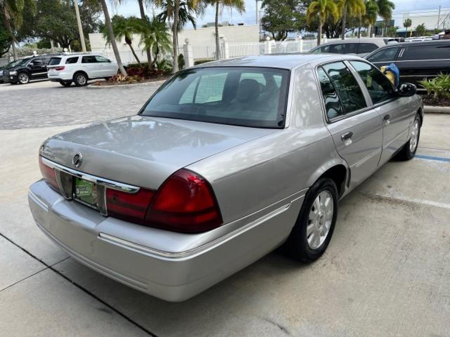 2004 Silver Birch Metallic /Light Flint Mercury Grand Marquis LS Ultimate LOW MILES 46,888 (2MEFM75W44X) with an 4.6L SOHC SEFI V8 Engine engine, Automatic transmission, located at 4701 North Dixie Hwy, Pompano Beach, FL, 33064, (954) 422-2889, 26.240938, -80.123474 - 2004 MERCURY GRAND MARQUIS LS PREMIUM NEW $ 33,310 ROAD READY VIN: 2MEFM75W44X662836 FLORIDA OWNER 4.6L V8 SEDAN 4 DR NO ACCIDENTS 3 SERV REC 4.6L V8 F DOHC POWER HEATED LEATHER SEATS GASOLINE POWER HEATED MIRRORS REAR WHEEL DRIVE LOW MILES 46,888 LS PREMIUM Alloy Wheels Approach Lights Auto-dimming - Photo#84