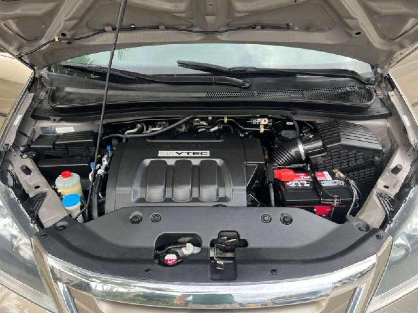 2010 Mocha Metallic /Gray Honda Odyssey LX LOW MILES 49,834 (5FNRL3H2XAB) with an 3.5L SOHC MPFI 24-Valve VTEC V6 Engine engine, Automatic transmission, located at 4701 North Dixie Hwy, Pompano Beach, FL, 33064, (954) 422-2889, 26.240938, -80.123474 - 2010 HONDA ODYSSEY LX NEW $ 31,189 ROAD READY VIN: 5FNRL3H2XAB056567 NO ACCIDENTS NO RECALLS VAN FLORIDA OWNER 3.5L V6 3.5L V6 F SOHC 24V 11 SERVICE RECORDS GASOLINE 3 ROW SEATS DUAL ZONE AC FRONT WHEEL DRIVE LOW MILES 49,834 Active Head Restraints Anti-Theft System Braking Assist Cruise Control Cur - Photo#17