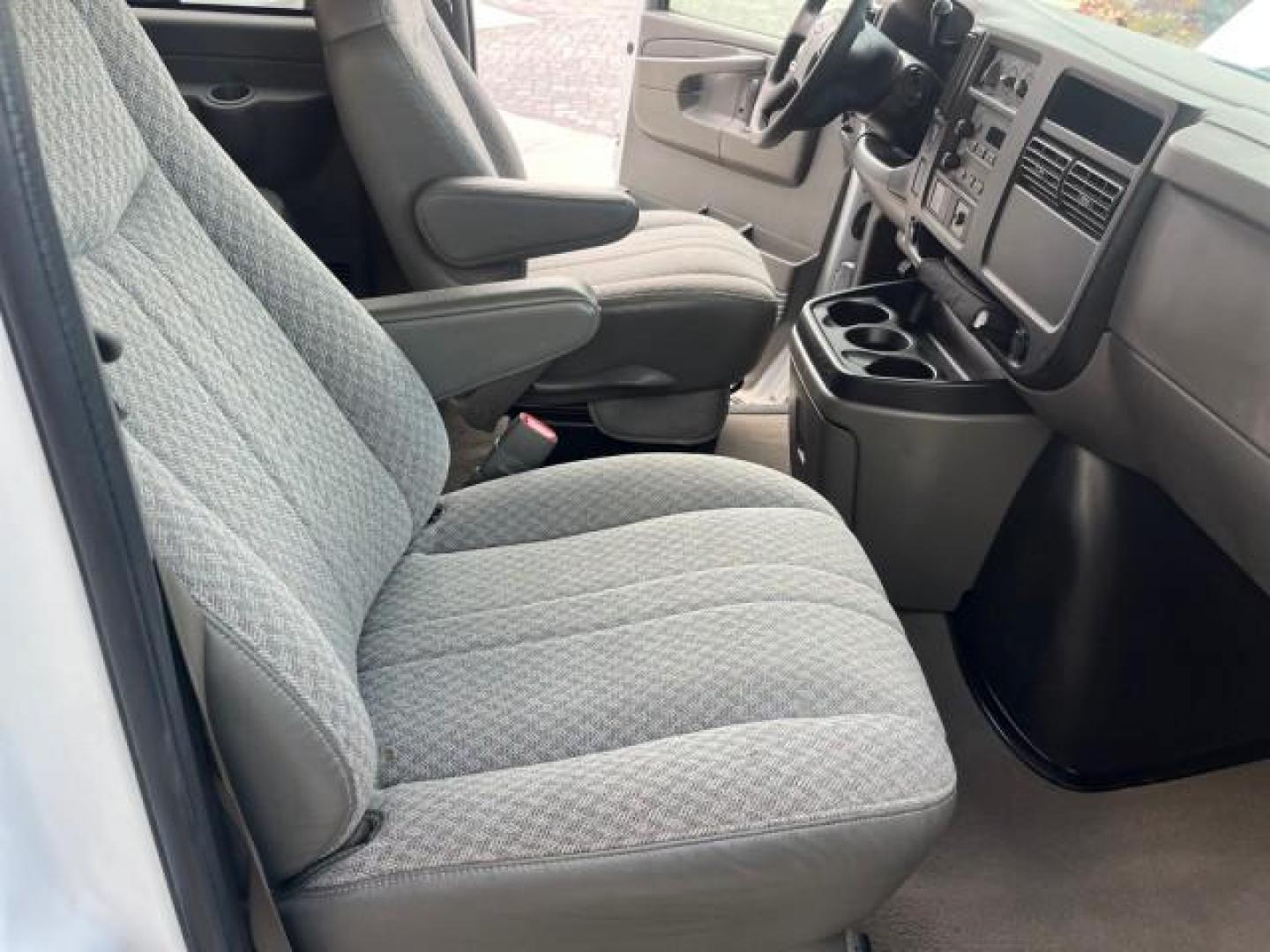 2007 Summit White /Medium Pewter Chevrolet Express 15 Passenger Van LOW MILES 33,128 (1GAHG39UX71) with an 6.0L Vortec 1000 V8 SFI Engine engine, Automatic transmission, located at 4701 North Dixie Hwy, Pompano Beach, FL, 33064, (954) 422-2889, 26.240938, -80.123474 - 2007 CHEVROLET EXPRESS LS 3500 15 PASS ROAD READY WORK READY VIN: 1GAHG39UX71130919 NO ACCIDENTS NO RECALLS VAN 13 SERVICE RECORDS 6.0L V8 F 1 OWNER 6.0L V8 15 PASSENGER GASOLINE POWER MIRRORS 4 ROW SEATS REAR WHEEL DRIVE LOW MILES 33,128 DUAL ZONE AC Active Head Restraints Anti-Theft System Auxilia - Photo#27