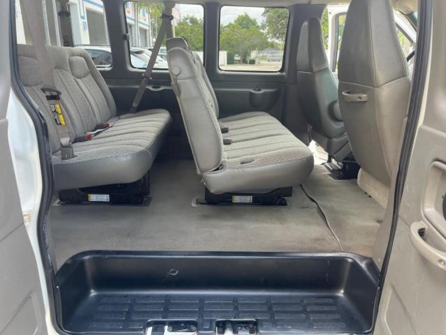 2007 Summit White /Medium Pewter Chevrolet Express 15 Passenger Van LOW MILES 33,128 (1GAHG39UX71) with an 6.0L Vortec 1000 V8 SFI Engine engine, Automatic transmission, located at 4701 North Dixie Hwy, Pompano Beach, FL, 33064, (954) 422-2889, 26.240938, -80.123474 - 2007 CHEVROLET EXPRESS LS 3500 15 PASS ROAD READY WORK READY VIN: 1GAHG39UX71130919 NO ACCIDENTS NO RECALLS VAN 13 SERVICE RECORDS 6.0L V8 F 1 OWNER 6.0L V8 15 PASSENGER GASOLINE POWER MIRRORS 4 ROW SEATS REAR WHEEL DRIVE LOW MILES 33,128 DUAL ZONE AC Active Head Restraints Anti-Theft System Auxilia - Photo#30