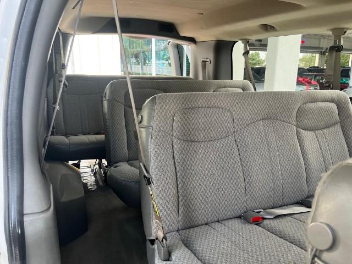 2007 Summit White /Medium Pewter Chevrolet Express 15 Passenger Van LOW MILES 33,128 (1GAHG39UX71) with an 6.0L Vortec 1000 V8 SFI Engine engine, Automatic transmission, located at 4701 North Dixie Hwy, Pompano Beach, FL, 33064, (954) 422-2889, 26.240938, -80.123474 - 2007 CHEVROLET EXPRESS LS 3500 15 PASS ROAD READY WORK READY VIN: 1GAHG39UX71130919 NO ACCIDENTS NO RECALLS VAN 13 SERVICE RECORDS 6.0L V8 F 1 OWNER 6.0L V8 15 PASSENGER GASOLINE POWER MIRRORS 4 ROW SEATS REAR WHEEL DRIVE LOW MILES 33,128 DUAL ZONE AC Active Head Restraints Anti-Theft System Auxilia - Photo#31