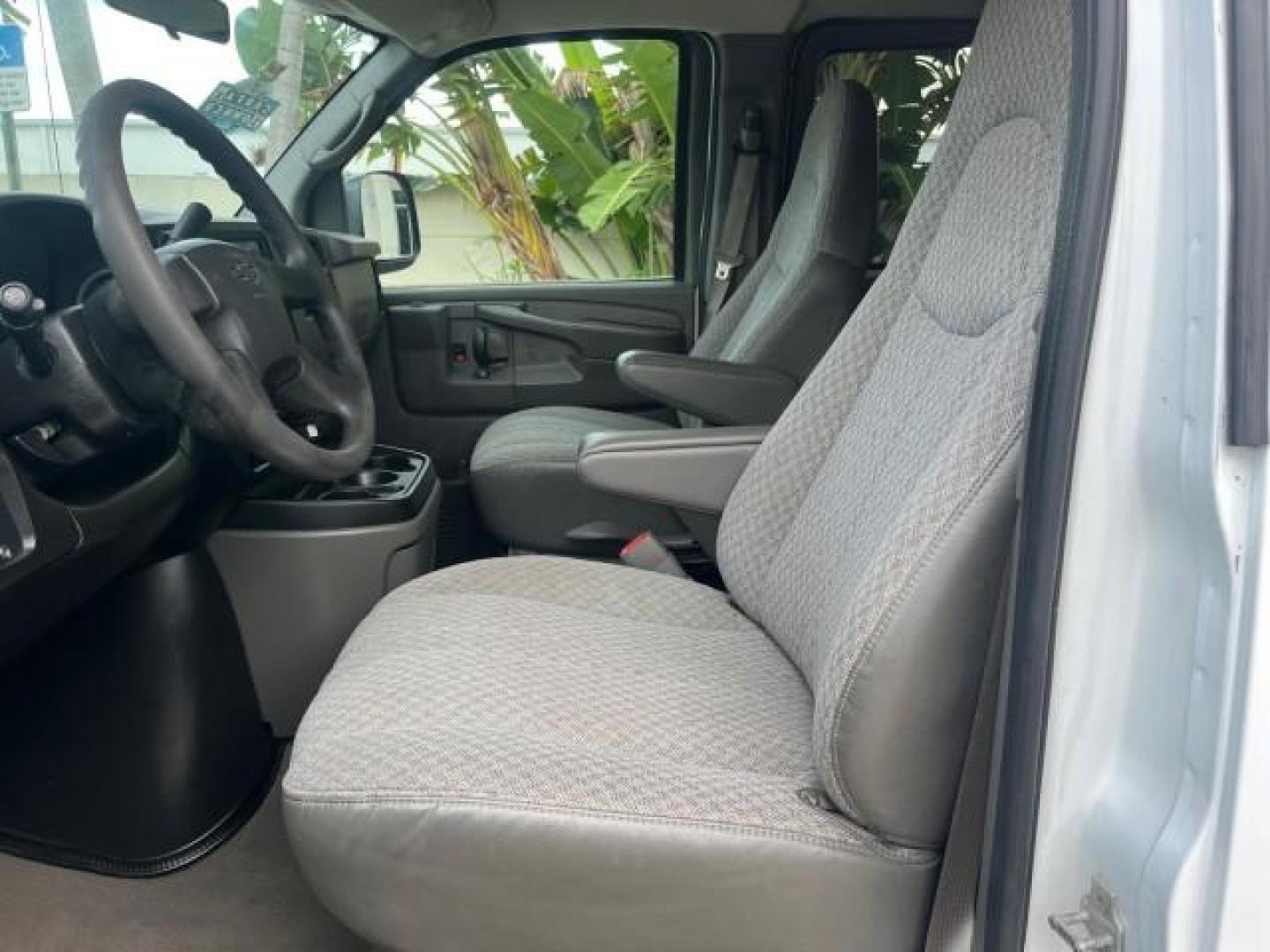 2007 Summit White /Medium Pewter Chevrolet Express 15 Passenger Van LOW MILES 33,128 (1GAHG39UX71) with an 6.0L Vortec 1000 V8 SFI Engine engine, Automatic transmission, located at 4701 North Dixie Hwy, Pompano Beach, FL, 33064, (954) 422-2889, 26.240938, -80.123474 - 2007 CHEVROLET EXPRESS LS 3500 15 PASS ROAD READY WORK READY VIN: 1GAHG39UX71130919 NO ACCIDENTS NO RECALLS VAN 13 SERVICE RECORDS 6.0L V8 F 1 OWNER 6.0L V8 15 PASSENGER GASOLINE POWER MIRRORS 4 ROW SEATS REAR WHEEL DRIVE LOW MILES 33,128 DUAL ZONE AC Active Head Restraints Anti-Theft System Auxilia - Photo#43