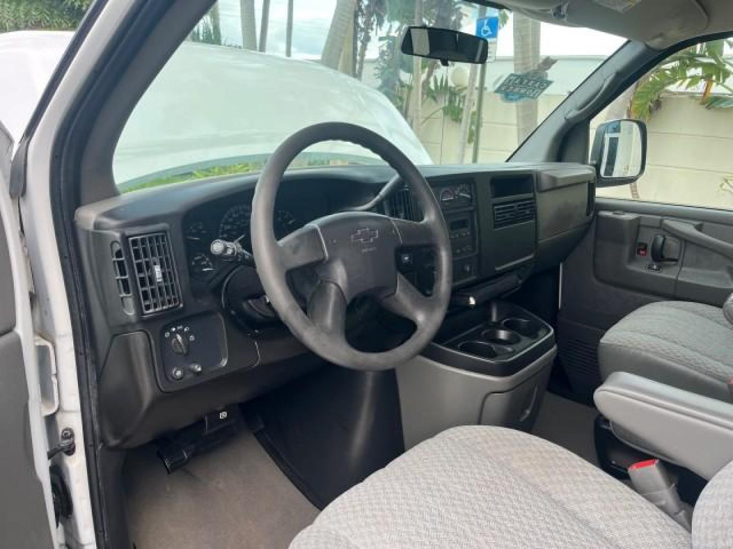 2007 Summit White /Medium Pewter Chevrolet Express 15 Passenger Van LOW MILES 33,128 (1GAHG39UX71) with an 6.0L Vortec 1000 V8 SFI Engine engine, Automatic transmission, located at 4701 North Dixie Hwy, Pompano Beach, FL, 33064, (954) 422-2889, 26.240938, -80.123474 - 2007 CHEVROLET EXPRESS LS 3500 15 PASS ROAD READY WORK READY VIN: 1GAHG39UX71130919 NO ACCIDENTS NO RECALLS VAN 13 SERVICE RECORDS 6.0L V8 F 1 OWNER 6.0L V8 15 PASSENGER GASOLINE POWER MIRRORS 4 ROW SEATS REAR WHEEL DRIVE LOW MILES 33,128 DUAL ZONE AC Active Head Restraints Anti-Theft System Auxilia - Photo#44