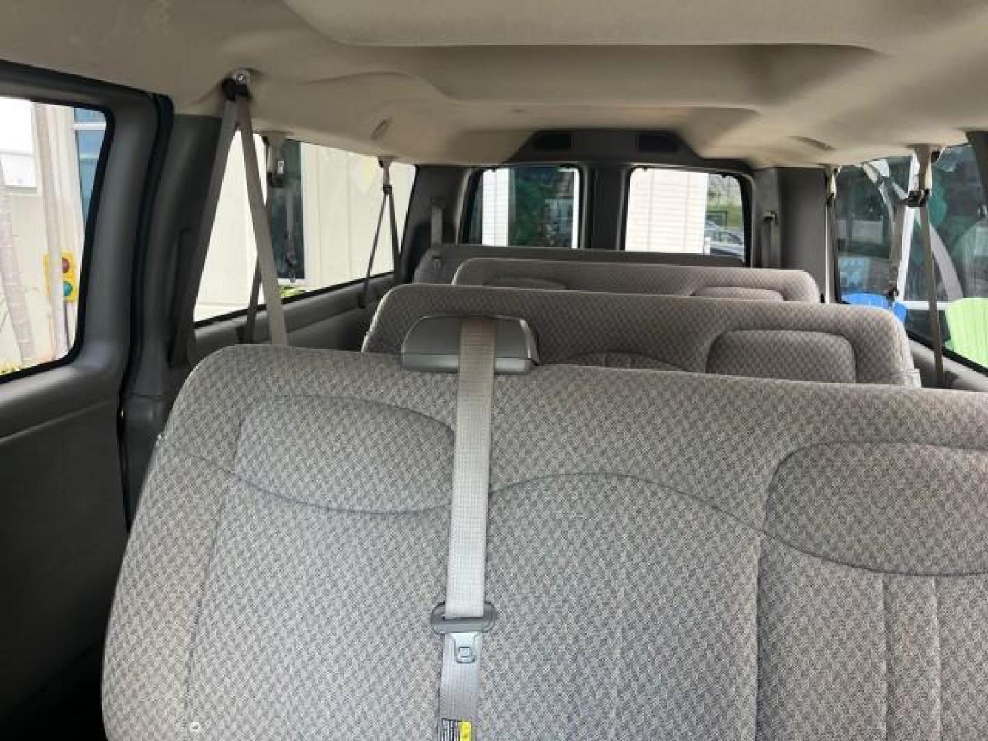 2007 Summit White /Medium Pewter Chevrolet Express 15 Passenger Van LOW MILES 33,128 (1GAHG39UX71) with an 6.0L Vortec 1000 V8 SFI Engine engine, Automatic transmission, located at 4701 North Dixie Hwy, Pompano Beach, FL, 33064, (954) 422-2889, 26.240938, -80.123474 - 2007 CHEVROLET EXPRESS LS 3500 15 PASS ROAD READY WORK READY VIN: 1GAHG39UX71130919 NO ACCIDENTS NO RECALLS VAN 13 SERVICE RECORDS 6.0L V8 F 1 OWNER 6.0L V8 15 PASSENGER GASOLINE POWER MIRRORS 4 ROW SEATS REAR WHEEL DRIVE LOW MILES 33,128 DUAL ZONE AC Active Head Restraints Anti-Theft System Auxilia - Photo#54