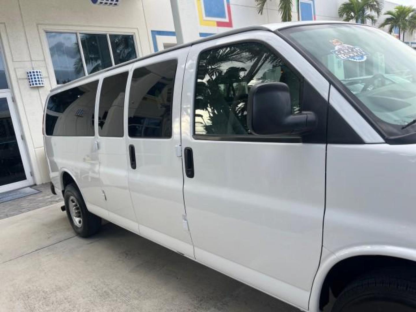 2007 Summit White /Medium Pewter Chevrolet Express 15 Passenger Van LOW MILES 33,128 (1GAHG39UX71) with an 6.0L Vortec 1000 V8 SFI Engine engine, Automatic transmission, located at 4701 North Dixie Hwy, Pompano Beach, FL, 33064, (954) 422-2889, 26.240938, -80.123474 - 2007 CHEVROLET EXPRESS LS 3500 15 PASS ROAD READY WORK READY VIN: 1GAHG39UX71130919 NO ACCIDENTS NO RECALLS VAN 13 SERVICE RECORDS 6.0L V8 F 1 OWNER 6.0L V8 15 PASSENGER GASOLINE POWER MIRRORS 4 ROW SEATS REAR WHEEL DRIVE LOW MILES 33,128 DUAL ZONE AC Active Head Restraints Anti-Theft System Auxilia - Photo#71