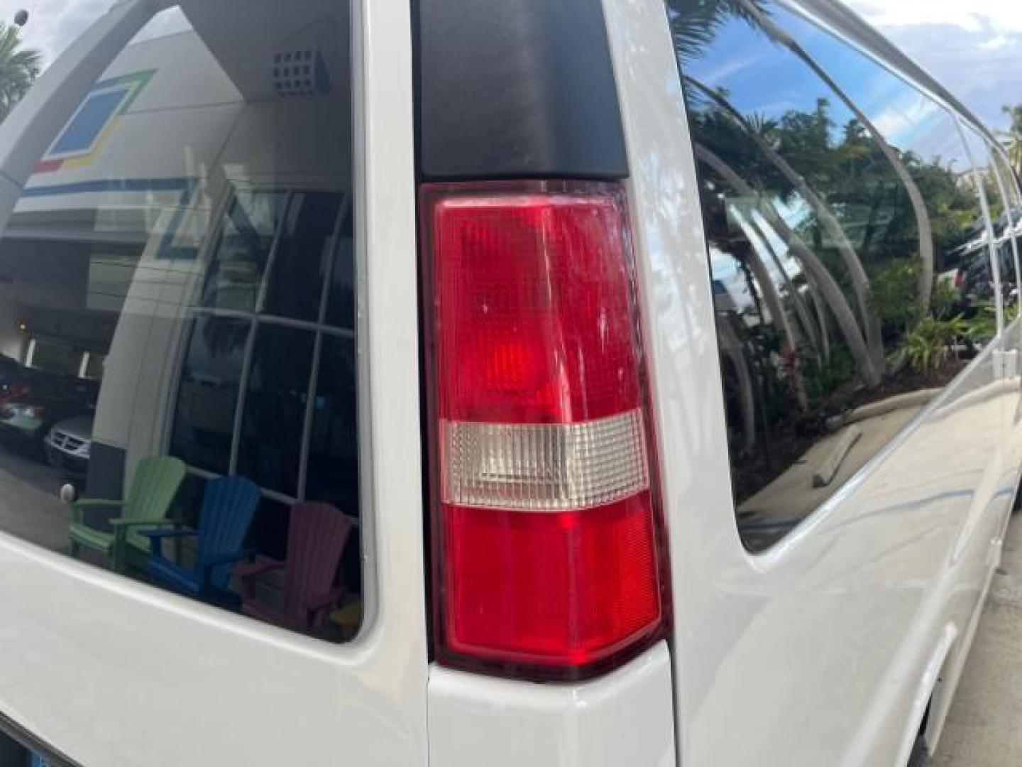 2007 Summit White /Medium Pewter Chevrolet Express 15 Passenger Van LOW MILES 33,128 (1GAHG39UX71) with an 6.0L Vortec 1000 V8 SFI Engine engine, Automatic transmission, located at 4701 North Dixie Hwy, Pompano Beach, FL, 33064, (954) 422-2889, 26.240938, -80.123474 - 2007 CHEVROLET EXPRESS LS 3500 15 PASS ROAD READY WORK READY VIN: 1GAHG39UX71130919 NO ACCIDENTS NO RECALLS VAN 13 SERVICE RECORDS 6.0L V8 F 1 OWNER 6.0L V8 15 PASSENGER GASOLINE POWER MIRRORS 4 ROW SEATS REAR WHEEL DRIVE LOW MILES 33,128 DUAL ZONE AC Active Head Restraints Anti-Theft System Auxilia - Photo#81