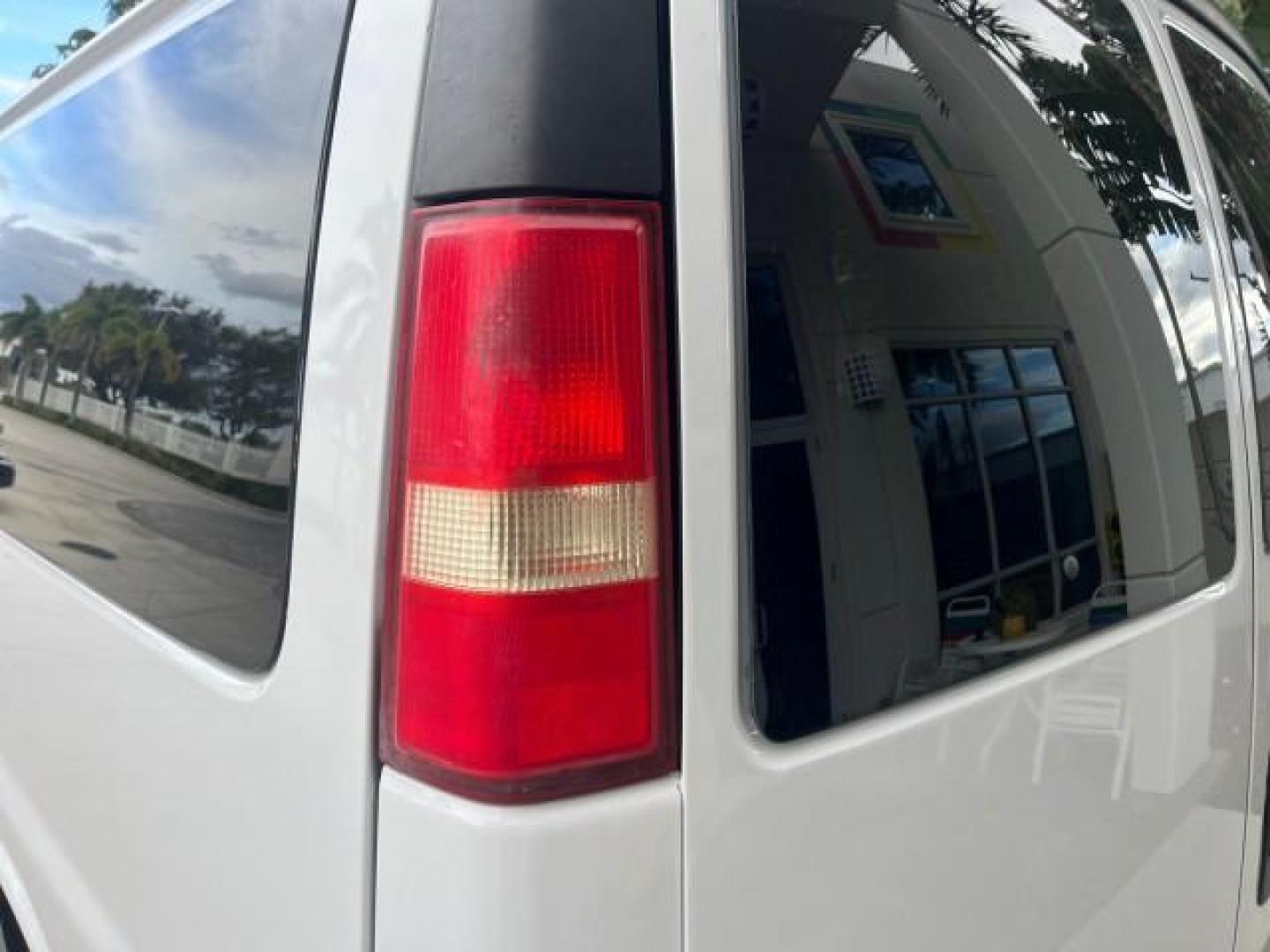 2007 Summit White /Medium Pewter Chevrolet Express 15 Passenger Van LOW MILES 33,128 (1GAHG39UX71) with an 6.0L Vortec 1000 V8 SFI Engine engine, Automatic transmission, located at 4701 North Dixie Hwy, Pompano Beach, FL, 33064, (954) 422-2889, 26.240938, -80.123474 - 2007 CHEVROLET EXPRESS LS 3500 15 PASS ROAD READY WORK READY VIN: 1GAHG39UX71130919 NO ACCIDENTS NO RECALLS VAN 13 SERVICE RECORDS 6.0L V8 F 1 OWNER 6.0L V8 15 PASSENGER GASOLINE POWER MIRRORS 4 ROW SEATS REAR WHEEL DRIVE LOW MILES 33,128 DUAL ZONE AC Active Head Restraints Anti-Theft System Auxilia - Photo#82