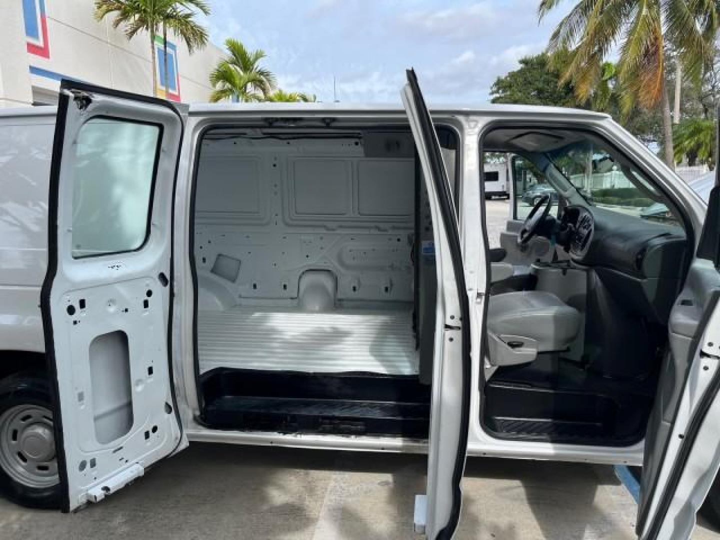 2005 Oxford White /Medium Flint Ford Econoline Cargo Van LOW MILES 57,376 (1FTRE14W25H) with an 4.6L SOHC EFI V8 Triton Engine engine, Automatic transmission, located at 4701 North Dixie Hwy, Pompano Beach, FL, 33064, (954) 422-2889, 26.240938, -80.123474 - OUR WEBPAGE FLORIDACARS1.COM HAS OVER 100 PHOTOS AND FREE CARFAX LINK 2005 FORD E-SERIES E-150 CARGO VAN NO RECALLS VIN: 1FTRE14W25HA67107 WORK READY VAN ROAD READY 4.6L V8 F SOHC LOW MILES 57,376 GASOLINE 4.6L V8 REAR WHEEL DRIVE 6 SERVICE RECORDS Automatic Climate Control Front Bucket Seats RWD TH - Photo#13