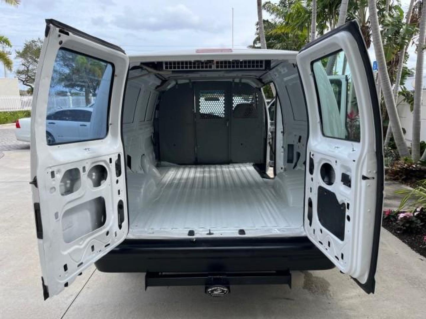 2005 Oxford White /Medium Flint Ford Econoline Cargo Van LOW MILES 57,376 (1FTRE14W25H) with an 4.6L SOHC EFI V8 Triton Engine engine, Automatic transmission, located at 4701 North Dixie Hwy, Pompano Beach, FL, 33064, (954) 422-2889, 26.240938, -80.123474 - OUR WEBPAGE FLORIDACARS1.COM HAS OVER 100 PHOTOS AND FREE CARFAX LINK 2005 FORD E-SERIES E-150 CARGO VAN NO RECALLS VIN: 1FTRE14W25HA67107 WORK READY VAN ROAD READY 4.6L V8 F SOHC LOW MILES 57,376 GASOLINE 4.6L V8 REAR WHEEL DRIVE 6 SERVICE RECORDS Automatic Climate Control Front Bucket Seats RWD TH - Photo#15