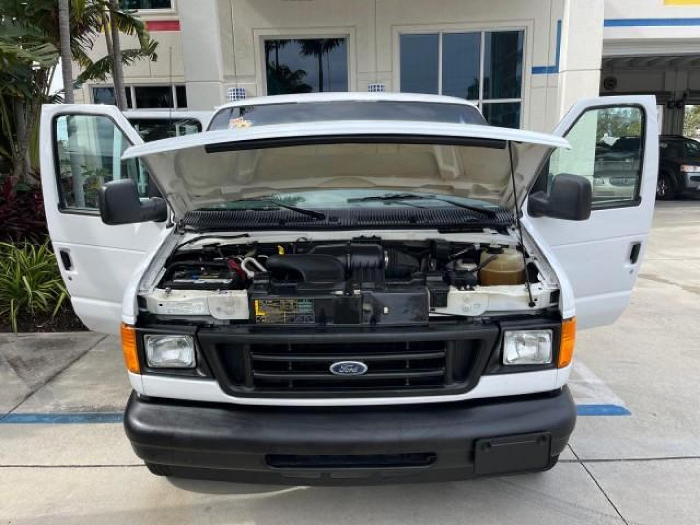 2005 Oxford White /Medium Flint Ford Econoline Cargo Van LOW MILES 57,376 (1FTRE14W25H) with an 4.6L SOHC EFI V8 Triton Engine engine, Automatic transmission, located at 4701 North Dixie Hwy, Pompano Beach, FL, 33064, (954) 422-2889, 26.240938, -80.123474 - OUR WEBPAGE FLORIDACARS1.COM HAS OVER 100 PHOTOS AND FREE CARFAX LINK 2005 FORD E-SERIES E-150 CARGO VAN NO RECALLS VIN: 1FTRE14W25HA67107 WORK READY VAN ROAD READY 4.6L V8 F SOHC LOW MILES 57,376 GASOLINE 4.6L V8 REAR WHEEL DRIVE 6 SERVICE RECORDS Automatic Climate Control Front Bucket Seats RWD TH - Photo#16