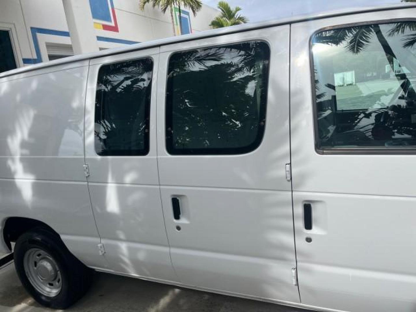 2005 Oxford White /Medium Flint Ford Econoline Cargo Van LOW MILES 57,376 (1FTRE14W25H) with an 4.6L SOHC EFI V8 Triton Engine engine, Automatic transmission, located at 4701 North Dixie Hwy, Pompano Beach, FL, 33064, (954) 422-2889, 26.240938, -80.123474 - OUR WEBPAGE FLORIDACARS1.COM HAS OVER 100 PHOTOS AND FREE CARFAX LINK 2005 FORD E-SERIES E-150 CARGO VAN NO RECALLS VIN: 1FTRE14W25HA67107 WORK READY VAN ROAD READY 4.6L V8 F SOHC LOW MILES 57,376 GASOLINE 4.6L V8 REAR WHEEL DRIVE 6 SERVICE RECORDS Automatic Climate Control Front Bucket Seats RWD TH - Photo#58