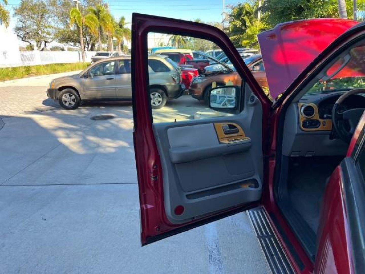 2004 Red Fire Metallic /Medium Flint Grey Ford Expedition XLS LOW MILES 54,849 (1FMRU13W74L) with an 4.6L SOHC SEFI V8 Triton Engine engine, Automatic transmission, located at 4701 North Dixie Hwy, Pompano Beach, FL, 33064, (954) 422-2889, 26.240938, -80.123474 - 2004 FORD EXPEDITION XLS NEW $ 33,235 ROAD READY VIN: 1FMRU13W74LB89943 FLORIDA OWNER 4.6L V8 4 DOOR WAGON/SPORT UTILITY LOW MILES 54,849 LEATHER 4.6L V8 F SOHC 16V 3 ROW SEATS NO RECALLS GASOLINE POWER MIRRORS AND SEATS REAR WHEEL DRIVE 6 SERVICE RECORDS Anti-Theft System Approach Lights Black Roof - Photo#9