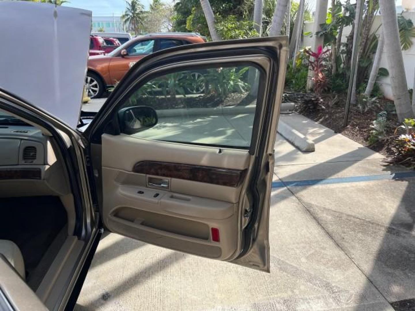 2005 Arizona Beige Metallic /Light Flint Mercury Grand Marquis 1 FL GS LOW MILES 43,746 (2MEFM74W95X) with an 4.6L OHC SEFI V8 Engine engine, Automatic transmission, located at 4701 North Dixie Hwy, Pompano Beach, FL, 33064, (954) 422-2889, 26.240938, -80.123474 - 2005 MERCURY GRAND MARQUIS GS ROAD READY 4.6L V8 VIN: 2MEFM74W95X643217 NO RECALLS POWER MIRRORS SEDAN 4 DR FLORIDA OWNER 4.6L V8 F DOHC LOW MILES 43,746 GASOLINE 13 SERVICE RECORDS REAR WHEEL DRIVE POWER LEATHER SEATS ABS Brakes AM/FM Stereo Air Conditioning Automatic Transmission CD Audio Cloth Se - Photo#11