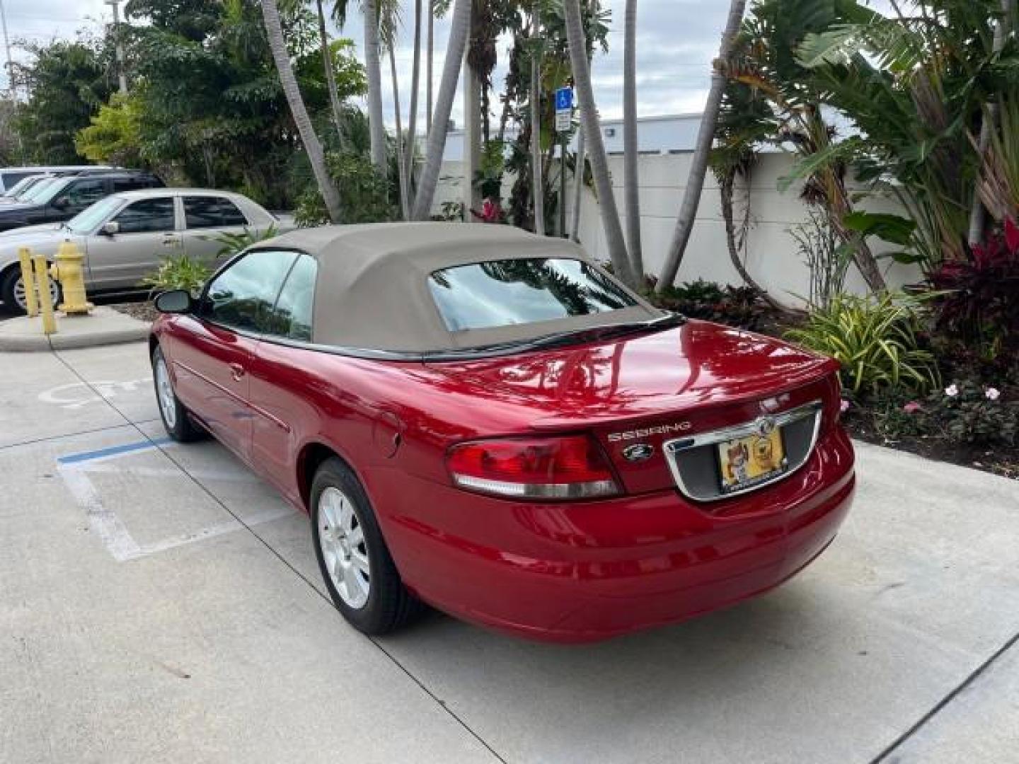 2004 Inferno Red Tinted Pearl /Dark Slate Gray Chrysler Sebring GTC LOW MILES 53,283 (1C3EL75R64N) with an 2.7L MPI DOHC 24-Valve V6 Engine engine, Automatic transmission, located at 4701 North Dixie Hwy, Pompano Beach, FL, 33064, (954) 422-2889, 26.240938, -80.123474 - 2004 CHRYSLER SEBRING GTC ROAD READY 2.7L V6 VIN: 1C3EL75R64N141665 NO ACCIDENTS CONVERTIBLE NO RECALLS 28 MPG 2.7L V6 F DOHC POWER CONVERTIBLE TOP GASOLINE POWER MIRRORS LOW MILES 53,283 FRONT WHEEL DRIVE POWER SEATS 12 SERVICE RECORDS Approach Lights Cruise Control Electronic Traction Control FWD - Photo#5