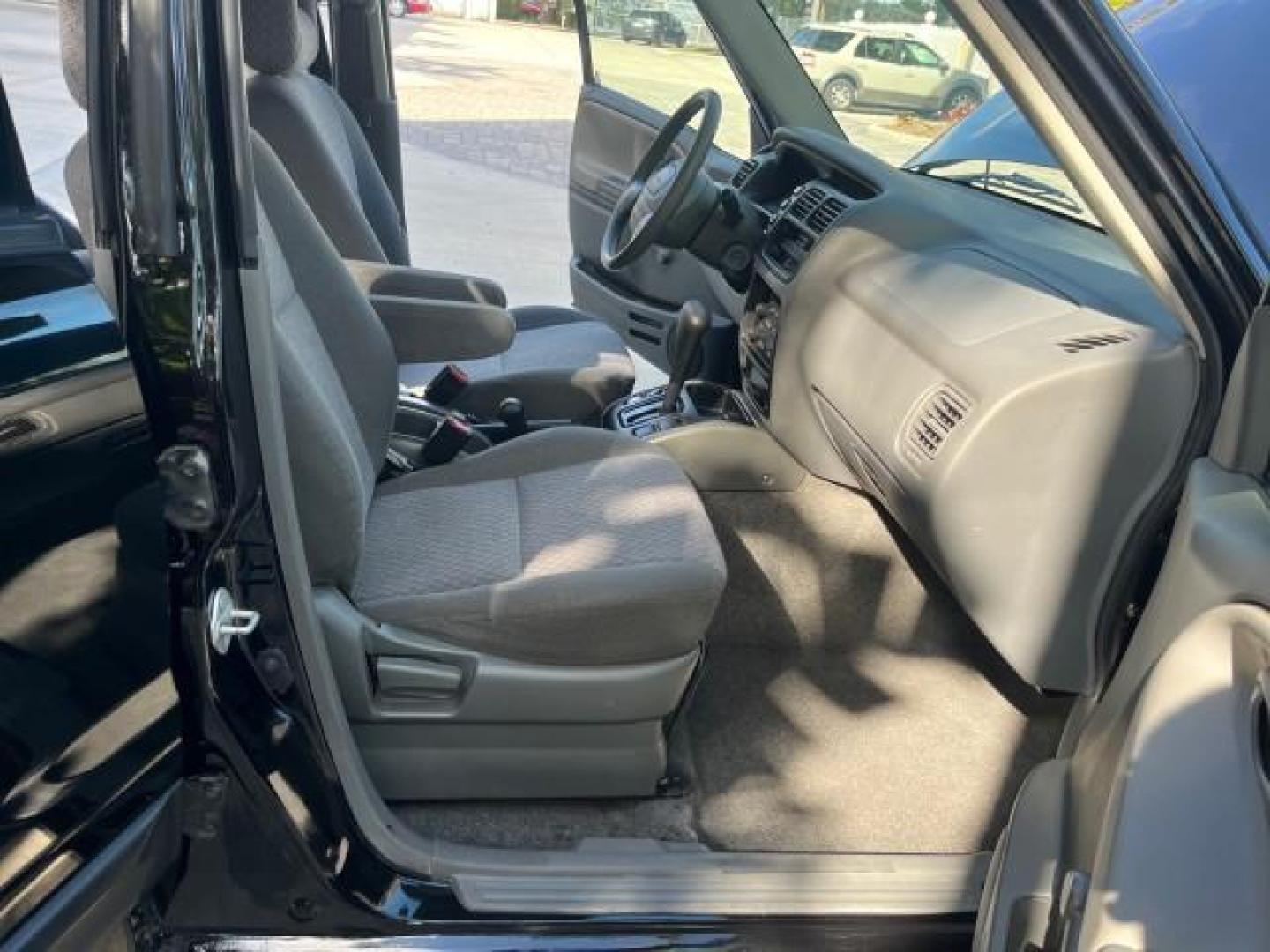 2004 Black /Medium Gray Chevrolet Tracker 4x4 loaded LOW MILES 73,735 (2CNBJ134246) with an 2.5L DOHC 24-Valve V6 Multi-Port Fuel Injection Engine engine, Automatic transmission, located at 4701 North Dixie Hwy, Pompano Beach, FL, 33064, (954) 422-2889, 26.240938, -80.123474 - OUR WEBPAGE FLORIDACARS1.COM HAS OVER 100 PHOTOS AND FREE CARFAX LINK 2004 CHEVROLET TRACKER ROAD READY 2.5L V6 VIN: 2CNBJ134246916181 NO ACCIDENTS 4 DOOR WAGON/SPORT UTILITY NO RECALLS 4X4 2.5L V6 F LOW MILES 73,735 GASOLINE ON DEMAND 4WD REAR WHEEL DRIVE W/ 4X4 20 SERVICE RECORDS 4WD Alloy Wheels - Photo#12