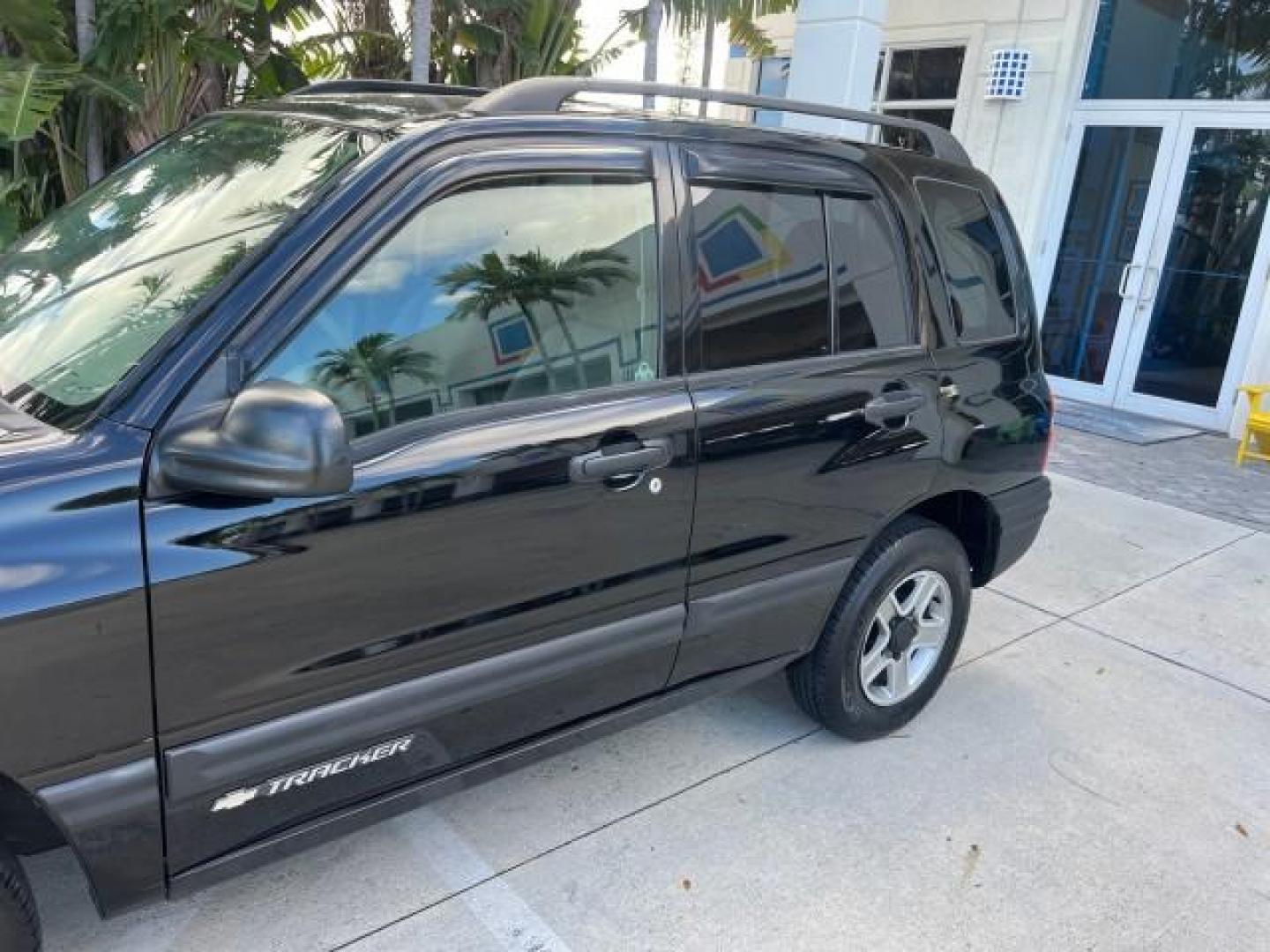 2004 Black /Medium Gray Chevrolet Tracker 4x4 loaded LOW MILES 73,735 (2CNBJ134246) with an 2.5L DOHC 24-Valve V6 Multi-Port Fuel Injection Engine engine, Automatic transmission, located at 4701 North Dixie Hwy, Pompano Beach, FL, 33064, (954) 422-2889, 26.240938, -80.123474 - OUR WEBPAGE FLORIDACARS1.COM HAS OVER 100 PHOTOS AND FREE CARFAX LINK 2004 CHEVROLET TRACKER ROAD READY 2.5L V6 VIN: 2CNBJ134246916181 NO ACCIDENTS 4 DOOR WAGON/SPORT UTILITY NO RECALLS 4X4 2.5L V6 F LOW MILES 73,735 GASOLINE ON DEMAND 4WD REAR WHEEL DRIVE W/ 4X4 20 SERVICE RECORDS 4WD Alloy Wheels - Photo#76