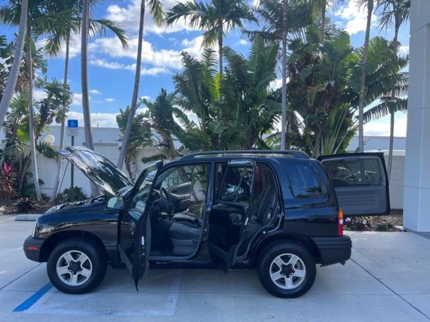 2004 Black /Medium Gray Chevrolet Tracker 4x4 loaded LOW MILES 73,735 (2CNBJ134246) with an 2.5L DOHC 24-Valve V6 Multi-Port Fuel Injection Engine engine, Automatic transmission, located at 4701 North Dixie Hwy, Pompano Beach, FL, 33064, (954) 422-2889, 26.240938, -80.123474 - OUR WEBPAGE FLORIDACARS1.COM HAS OVER 100 PHOTOS AND FREE CARFAX LINK 2004 CHEVROLET TRACKER ROAD READY 2.5L V6 VIN: 2CNBJ134246916181 NO ACCIDENTS 4 DOOR WAGON/SPORT UTILITY NO RECALLS 4X4 2.5L V6 F LOW MILES 73,735 GASOLINE ON DEMAND 4WD REAR WHEEL DRIVE W/ 4X4 20 SERVICE RECORDS 4WD Alloy Wheels - Photo#8