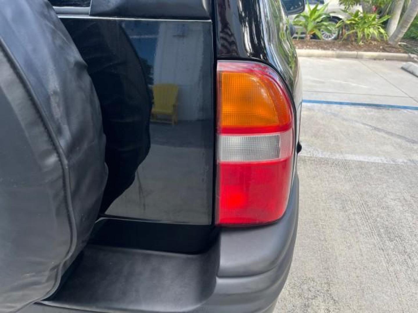 2004 Black /Medium Gray Chevrolet Tracker 4x4 loaded LOW MILES 73,735 (2CNBJ134246) with an 2.5L DOHC 24-Valve V6 Multi-Port Fuel Injection Engine engine, Automatic transmission, located at 4701 North Dixie Hwy, Pompano Beach, FL, 33064, (954) 422-2889, 26.240938, -80.123474 - OUR WEBPAGE FLORIDACARS1.COM HAS OVER 100 PHOTOS AND FREE CARFAX LINK 2004 CHEVROLET TRACKER ROAD READY 2.5L V6 VIN: 2CNBJ134246916181 NO ACCIDENTS 4 DOOR WAGON/SPORT UTILITY NO RECALLS 4X4 2.5L V6 F LOW MILES 73,735 GASOLINE ON DEMAND 4WD REAR WHEEL DRIVE W/ 4X4 20 SERVICE RECORDS 4WD Alloy Wheels - Photo#95