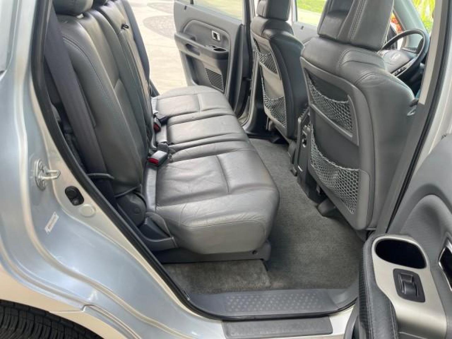 2004 Starlight Silver Metallic /Fern Honda Pilot EX LOW MILES 56,071 4X4 (2HKYF18514H) with an 3.5L SOHC PGM-FI 24-Valve VTEC V6 Engine engine, Automatic transmission, located at 4701 North Dixie Hwy, Pompano Beach, FL, 33064, (954) 422-2889, 26.240938, -80.123474 - OUR WEBPAGE FLORIDACARS1.COM HAS OVER 100 PHOTOS AND FREE CARFAX LINK 2004 HONDA PILOT EX-L ROAD READY 3.5L V6 VIN: 2HKYF18514H608187 NO ACCIDENTS 4 DOOR WAGON/SPORT UTILITY NO RECALLS 3.5L V6 F SOHC POWER MIRRORS FLORIDA OWNER GASOLINE POWER SEASTS 3 ROW LEATHER SEATS ALL WHEEL DRIVE 23 SERVICE REC - Photo#69