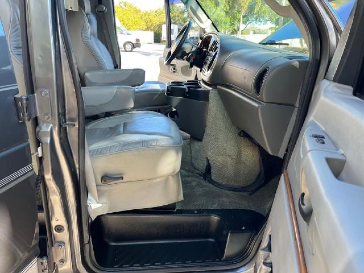 2008 Dark Shadow Grey Metallic /Medium flint Ford Econoline CONVERSION Van TUSCANY CONV LOW MILES 85,653 (1FDNE14W78D) with an 4.6L SOHC EFI V8 Triton Engine engine, Automatic transmission, located at 4701 North Dixie Hwy, Pompano Beach, FL, 33064, (954) 422-2889, 26.240938, -80.123474 - 2008 FORD ECONOLINE E150 TUSCANY CONVERSION ROAD READY 4.6L V8 VIN: 1FDNE14W78DA12545 NO ACCIDENTS NO RECALLS VAN POWER LEATHER SEATS 4.6L V8 F SOHC 16V POWER MIRRORS GASOLINE DVD ENTERTAINMENT 4 SERVICE RECORDS REAR WHEEL DRIVE BACK UP SENSORS LOW MILES 85,653 THIS IS ONE OF THE NICEST FORD CONVERS - Photo#12