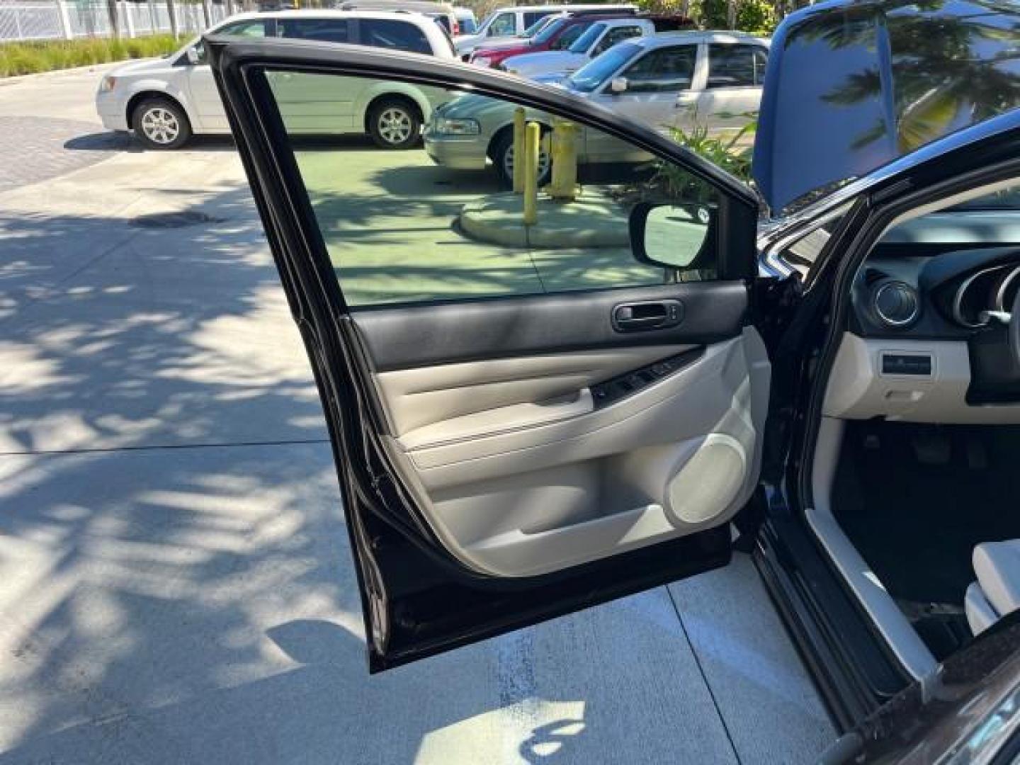 2011 Black Cherry Mica /Black Mazda CX-7 1 FL i SV LOW MILES 59,855 (JM3ER2A5XB0) with an 2.5L DOHC 16-Valve VVT I4 Engine engine, Automatic transmission, located at 4701 North Dixie Hwy, Pompano Beach, FL, 33064, (954) 422-2889, 26.240938, -80.123474 - 2011 MAZDA CX-7 I SV ROAD READY 2.5L I4 VIN: JM3ER2A5XB0409487 NO ACCIDENTS 28 MPG 4 DOOR WAGON/SPORT UTILITY NO RECALLS 2.5L I4 F DOHC 16V 1 OWNER FLORIDA GASOLINE LOW MILES 59,855 FRONT WHEEL DRIVE 18 SERVICE RECORDS Alloy Wheels Anti-Theft System Approach Lights Braking Assist Cruise Control Curt - Photo#9