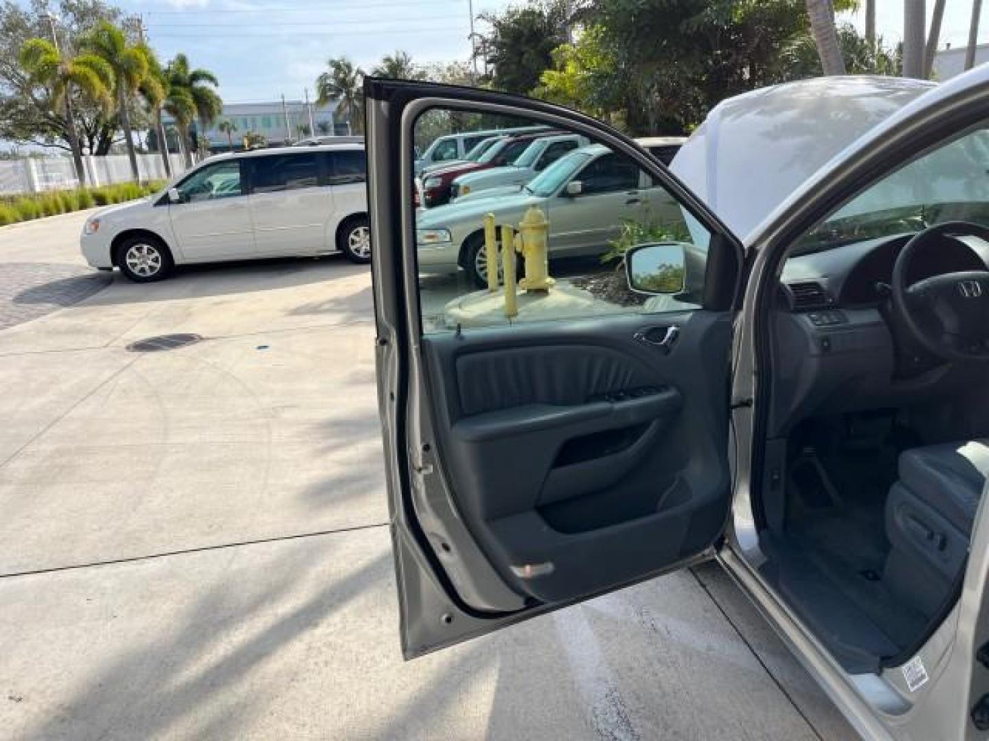 2007 Silver Pearl Metallic /Gray Honda Odyssey 1 EX-L LOW MILES 57,826 (5FNRL38777B) with an 3.5L SOHC MPFI 24-Valve i-VTEC V6 Engine engine, Automatic transmission, located at 4701 North Dixie Hwy, Pompano Beach, FL, 33064, (954) 422-2889, 26.240938, -80.123474 - 2007 HONDA ODYSSEY EX-L W/DVD NEW $35,106 ROAD READY VIN: 5FNRL38777B460172 NO ACCIDENTS NO RECALLS VAN 3 ROW SEATS 1 OWNER DUAL AC 3.5L V6 3.5L V6 F SOHC 24V LOW MILES 57,826 POWER SLIDING DOORS GASOLINE POWER MIRRORS POWER HEATED LEATHER SEATS FRONT WHEEL DRIVE POWER SUNROOF DVD VIDEO SYSTEM Anti- - Photo#9