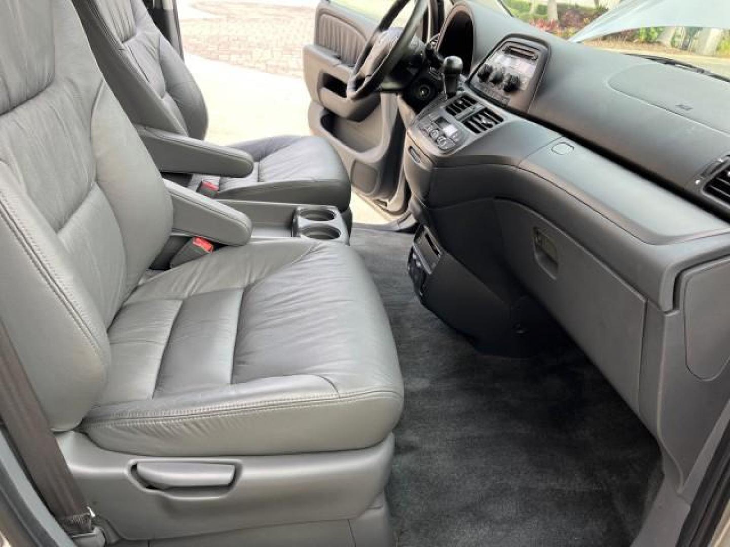 2007 Silver Pearl Metallic /Gray Honda Odyssey 1 EX-L LOW MILES 57,826 (5FNRL38777B) with an 3.5L SOHC MPFI 24-Valve i-VTEC V6 Engine engine, Automatic transmission, located at 4701 North Dixie Hwy, Pompano Beach, FL, 33064, (954) 422-2889, 26.240938, -80.123474 - 2007 HONDA ODYSSEY EX-L W/DVD NEW $35,106 ROAD READY VIN: 5FNRL38777B460172 NO ACCIDENTS NO RECALLS VAN 3 ROW SEATS 1 OWNER DUAL AC 3.5L V6 3.5L V6 F SOHC 24V LOW MILES 57,826 POWER SLIDING DOORS GASOLINE POWER MIRRORS POWER HEATED LEATHER SEATS FRONT WHEEL DRIVE POWER SUNROOF DVD VIDEO SYSTEM Anti- - Photo#25