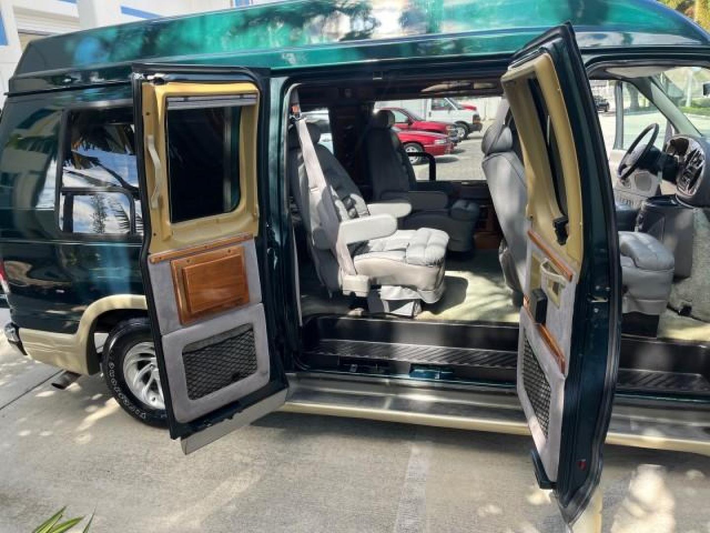 1999 Emerald Green Metallic /Medium Graphite Ford Econoline CONVERSION Van 1 FL LOW MILES 84,946 (1FDRE14L1XH) with an 5.4L SOHC SEFI V8 Triton Engine engine, Automatic transmission, located at 4701 North Dixie Hwy, Pompano Beach, FL, 33064, (954) 422-2889, 26.240938, -80.123474 - 1999 FORD ECONOLINE E150 ROAD READY TRAVEL READY VIN: 1FDRE14L1XHB78994 NO ACCIDENTS TV WITH VCR VAN NO RECALLS 5.4L V8 F SOHC 16V 1 OWNER FLORIDA 5.4L V8 GASOLINE STARCRAFT CONVERSION LOW MILES 84,946 REAR WHEEL DRIVE POWER LEATHER SEATS POPWER MIRRORS ABS Brakes AM/FM Stereo Air Conditioning Alloy - Photo#13