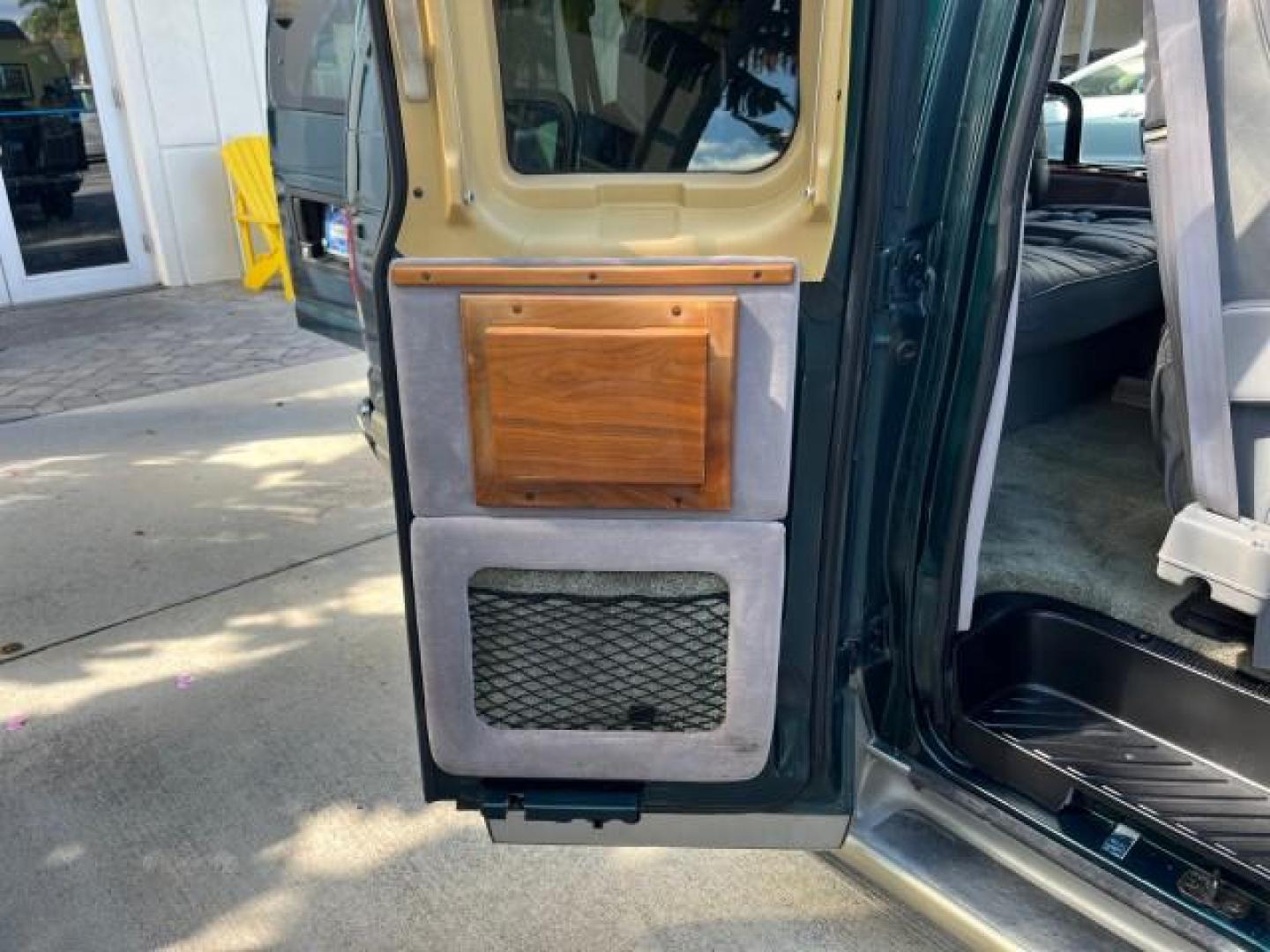 1999 Emerald Green Metallic /Medium Graphite Ford Econoline CONVERSION Van 1 FL LOW MILES 84,946 (1FDRE14L1XH) with an 5.4L SOHC SEFI V8 Triton Engine engine, Automatic transmission, located at 4701 North Dixie Hwy, Pompano Beach, FL, 33064, (954) 422-2889, 26.240938, -80.123474 - 1999 FORD ECONOLINE E150 ROAD READY TRAVEL READY VIN: 1FDRE14L1XHB78994 NO ACCIDENTS TV WITH VCR VAN NO RECALLS 5.4L V8 F SOHC 16V 1 OWNER FLORIDA 5.4L V8 GASOLINE STARCRAFT CONVERSION LOW MILES 84,946 REAR WHEEL DRIVE POWER LEATHER SEATS POPWER MIRRORS ABS Brakes AM/FM Stereo Air Conditioning Alloy - Photo#28