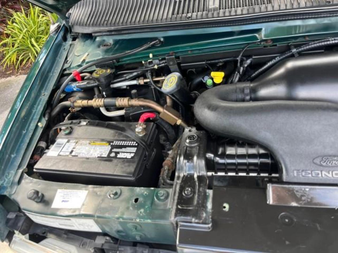 1999 Emerald Green Metallic /Medium Graphite Ford Econoline CONVERSION Van 1 FL LOW MILES 84,946 (1FDRE14L1XH) with an 5.4L SOHC SEFI V8 Triton Engine engine, Automatic transmission, located at 4701 North Dixie Hwy, Pompano Beach, FL, 33064, (954) 422-2889, 26.240938, -80.123474 - 1999 FORD ECONOLINE E150 ROAD READY TRAVEL READY VIN: 1FDRE14L1XHB78994 NO ACCIDENTS TV WITH VCR VAN NO RECALLS 5.4L V8 F SOHC 16V 1 OWNER FLORIDA 5.4L V8 GASOLINE STARCRAFT CONVERSION LOW MILES 84,946 REAR WHEEL DRIVE POWER LEATHER SEATS POPWER MIRRORS ABS Brakes AM/FM Stereo Air Conditioning Alloy - Photo#65