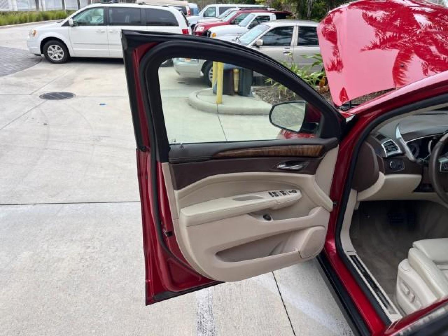 2010 Crystal Red Tintcoat /Shale w/Ebony upper accents Cadillac SRX Luxury Collection LOW MILES 76,601 (3GYFNAEY7AS) with an 3.0L VVT DOHC V6 SIDI Engine engine, Automatic transmission, located at 4701 North Dixie Hwy, Pompano Beach, FL, 33064, (954) 422-2889, 26.240938, -80.123474 - OUR WEBPAGE FLORIDACARS1.COM HAS OVER 100 PHOTOS AND FREE CARFAX LINK 2010 CADILLAC SRX LUXURY COLLECTION NEW $ 40,505 ROAD READY VIN: 3GYFNAEY7AS640260 NO RECALLS BLUETOOTH 4 DOOR WAGON/SPORT UTILITY PARK SENSORS DVD 3.0L V6 F DOHC 24V PUSH BUTTON START POWER HEATED LEATHER SEATS GASOLINE FLORIDA O - Photo#9