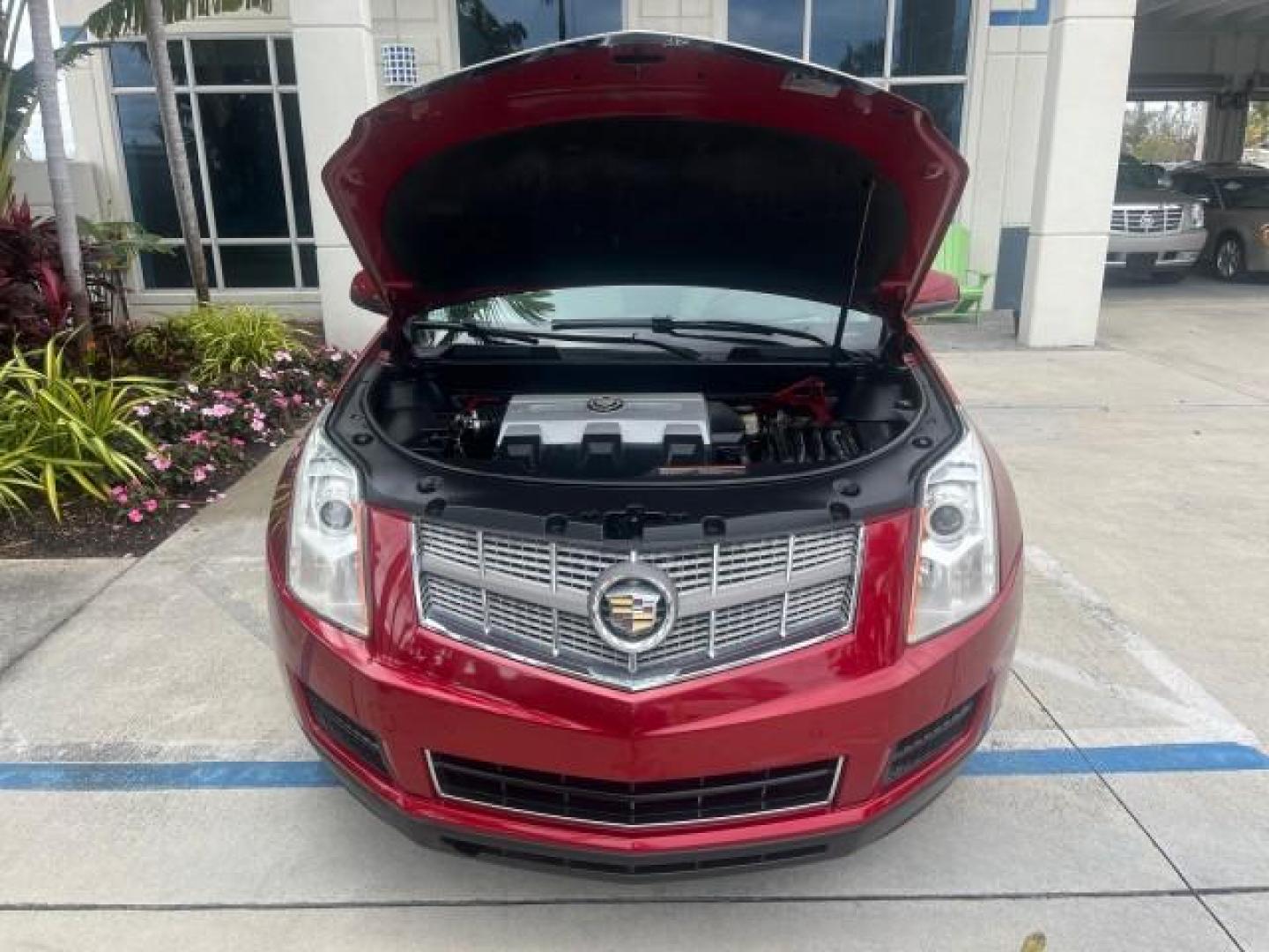 2010 Crystal Red Tintcoat /Shale w/Ebony upper accents Cadillac SRX Luxury Collection LOW MILES 76,601 (3GYFNAEY7AS) with an 3.0L VVT DOHC V6 SIDI Engine engine, Automatic transmission, located at 4701 North Dixie Hwy, Pompano Beach, FL, 33064, (954) 422-2889, 26.240938, -80.123474 - OUR WEBPAGE FLORIDACARS1.COM HAS OVER 100 PHOTOS AND FREE CARFAX LINK 2010 CADILLAC SRX LUXURY COLLECTION NEW $ 40,505 ROAD READY VIN: 3GYFNAEY7AS640260 NO RECALLS BLUETOOTH 4 DOOR WAGON/SPORT UTILITY PARK SENSORS DVD 3.0L V6 F DOHC 24V PUSH BUTTON START POWER HEATED LEATHER SEATS GASOLINE FLORIDA O - Photo#66