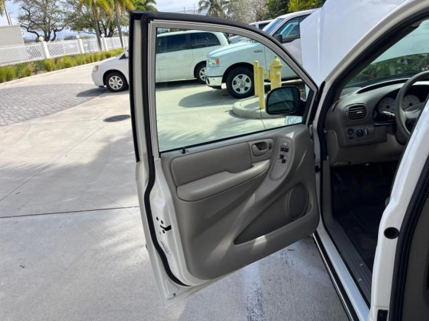 2003 Stone White /Sandstone Chrysler Voyager 1 FL LX LOW MILES 75,819 (1C4GJ45393B) with an 3.3L OHV Flex-Fuel V6 Engine engine, Automatic transmission, located at 4701 North Dixie Hwy, Pompano Beach, FL, 33064, (954) 422-2889, 26.240938, -80.123474 - 2003 CHRYSLER VOYAGER LX POPULAR NON SMOKER ROAD READY 3.3L V6 VIN: 1C4GJ45393B133015 NO RECALLS VAN 1 OWNER FLORIDA 3.3L V6 F SOHC 12V LOW MILES 75,819 GASOLINE 15 SERVICE RECORDS FRONT WHEEL DRIVE 3 ROW SEATS Approach Lights FWD Front Bucket Seats Rear Privacy Glass THIS IS ONE OF THE NICEST CHRYS - Photo#9