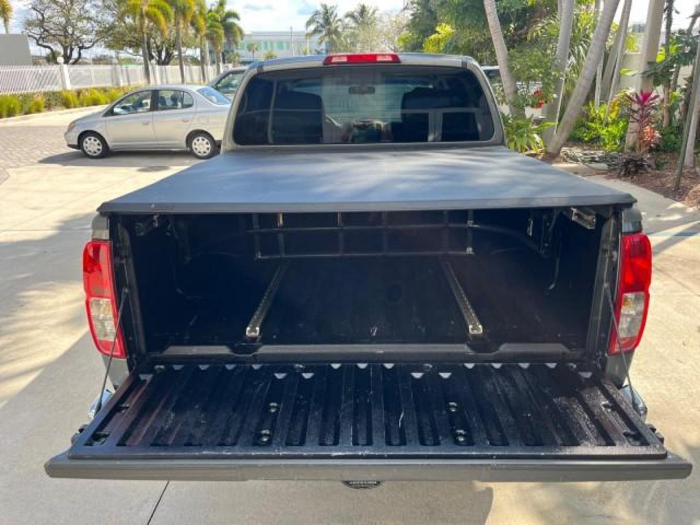 2007 Storm Gray /Charcoal Nissan Frontier SE 4 DR LOW MILES 71,664 (1N6AD07U27C) with an 4.0L DOHC 24-Valve V6 Engine engine, Automatic transmission, located at 4701 North Dixie Hwy, Pompano Beach, FL, 33064, (954) 422-2889, 26.240938, -80.123474 - 2007 NISSAN FRONTIER SE 4 DR ROAD READY 4.OL V6 VIN: 1N6AD07U27C438803 NO ACCIDENTS CREW PICKUP 18 SERVICE RECORDS 4.0L V6 F DOHC 24V LOW MILES 71,664 GASOLINE POWER MIRRORS REAR WHEEL DRIVE 5 FT BED TOW HITCH Alloy Wheels Cloth Seats Bed Liner Tow Hitch THIS IS ONE OF THE NICEST NISSANS WE HAVE EVE - Photo#60