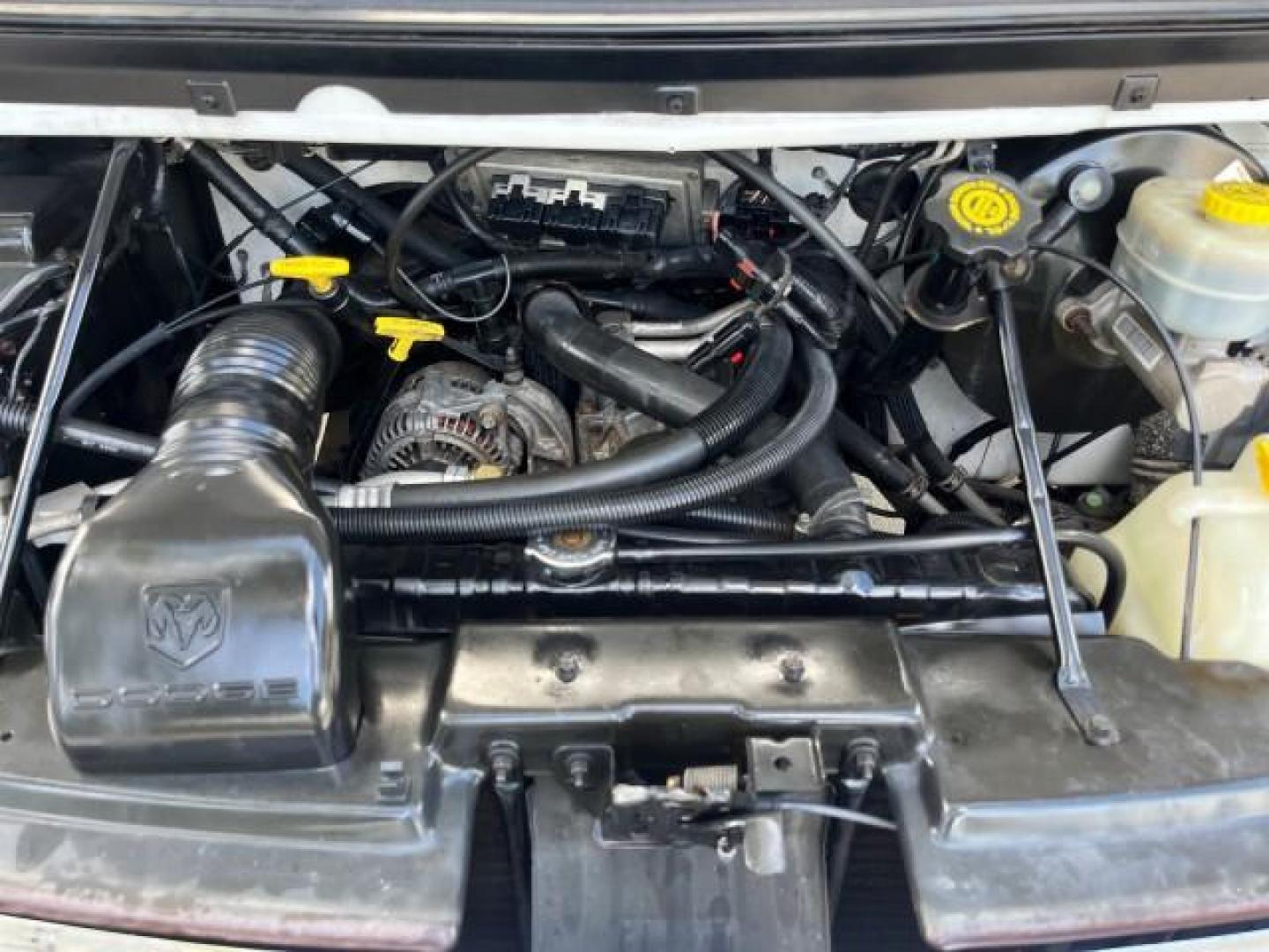 2001 Bright White /Dark Slate Gray Dodge Ram Wagon 3500 15 PASS LOW MILES 70,056 (2B5WB35Z81K) with an 5.9L SMPI V8 Magnum Engine engine, Automatic transmission, located at 4701 North Dixie Hwy, Pompano Beach, FL, 33064, (954) 422-2889, 26.240938, -80.123474 - 2001 DODGE RAM VAN 3500 MAXI EXT ROAD READY 5,9L V8 VIN: 2B5WB35Z81K531405 LOW MILES 70,056 VAN 15 PASSANGER 5.9L V8 F OHV 16V 4 ROW SEATS GASOLINE 5 SERVICE RECORDS REAR WHEEL DRIVE POWER MIRRORS Approach Lights Front Bucket Seats RWD THIS IS ONE OF THE NICEST DODGE RAMS WE HAVE EVER LISTED RETIREE - Photo#51