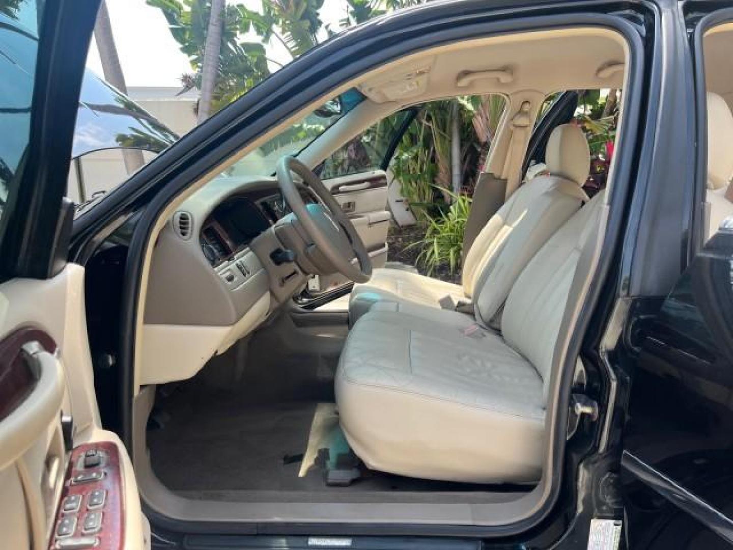 2005 Black /Dk/Med Lt Stone Lincoln Town Car Signature LOW MILES 69.333 (1LNHM81W75Y) with an 4.6L SOHC SMPI V8 Engine engine, Automatic transmission, located at 4701 North Dixie Hwy, Pompano Beach, FL, 33064, (954) 422-2889, 26.240938, -80.123474 - 2005 LINCOLN TOWN CAR SIGNATURE NEW $ 42,055 ROAD READY VIN: 1LNHM81W75Y664843 NO RECALLS 4.6L V8 SEDAN 4 DR SIGNATURE FLORIDA OWNER 4.6L V8 F OHV 16V POWER SEATS/MIRRORS LOW MILES 69,333 GASOLINE 6 SERVICE RECORDS PARKING SENSORS REAR WHEEL DRIVE DUAL ZONE AC LEATHER SEATS Alloy Wheels Anti-Theft S - Photo#10