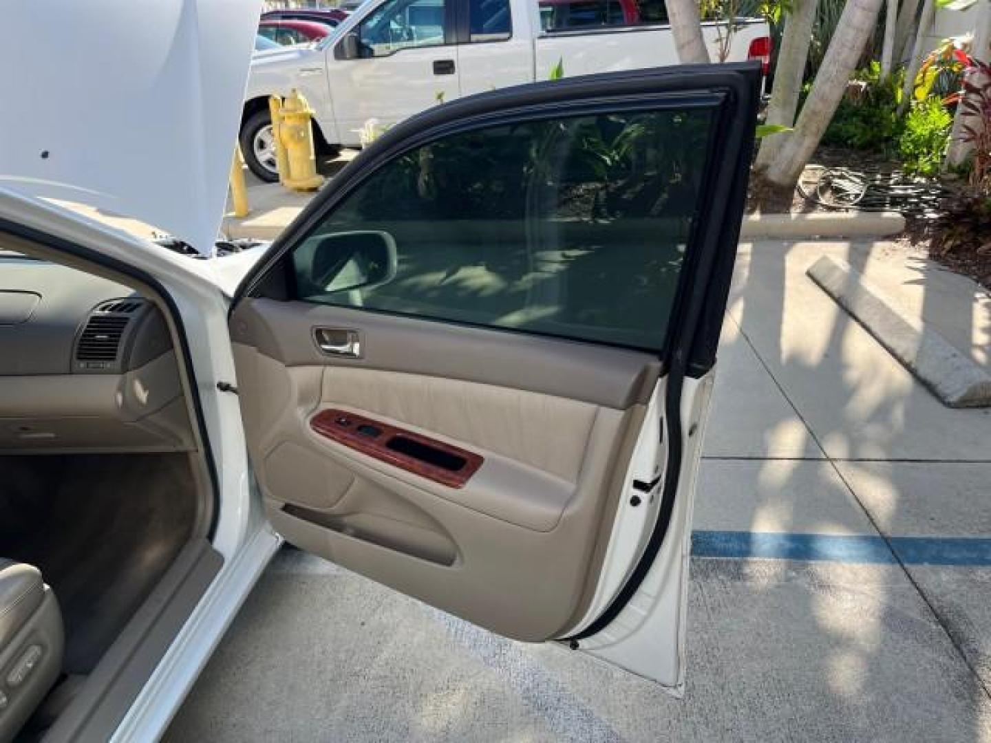 2004 Super White /Stone Toyota Camry XLE LOW MILES 75,074 (4T1BE32K14U) with an 2.4L DOHC MPFI Vvti 16-Valve 4-Cyl Engine engine, Automatic transmission, located at 4701 North Dixie Hwy, Pompano Beach, FL, 33064, (954) 422-2889, 26.240938, -80.123474 - 2004 TOYOTA CAMRY LE ROAD READY 2.4L I4 VIN: 4T1BE32K14U362181 NO ACCIDENTS SEDAN 4 DR WOOD TRIM XLE NO RECALLS 32 MPG 2.4L I4 F DOHC 16V POWER SUNROOF FLORIDA OWNER GASOLINE POWER MIRRORS LOW MILES 75,074 FRONT WHEEL DRIVE POWER LEATHER SEATS 23 SERVICE RECORDS Approach Lights Cruise Control FWD Fr - Photo#11