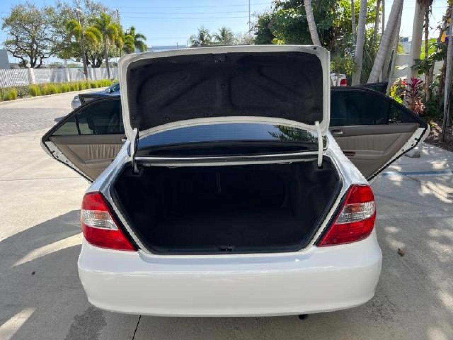 2004 Super White /Stone Toyota Camry XLE LOW MILES 75,074 (4T1BE32K14U) with an 2.4L DOHC MPFI Vvti 16-Valve 4-Cyl Engine engine, Automatic transmission, located at 4701 North Dixie Hwy, Pompano Beach, FL, 33064, (954) 422-2889, 26.240938, -80.123474 - 2004 TOYOTA CAMRY LE ROAD READY 2.4L I4 VIN: 4T1BE32K14U362181 NO ACCIDENTS SEDAN 4 DR WOOD TRIM XLE NO RECALLS 32 MPG 2.4L I4 F DOHC 16V POWER SUNROOF FLORIDA OWNER GASOLINE POWER MIRRORS LOW MILES 75,074 FRONT WHEEL DRIVE POWER LEATHER SEATS 23 SERVICE RECORDS Approach Lights Cruise Control FWD Fr - Photo#15