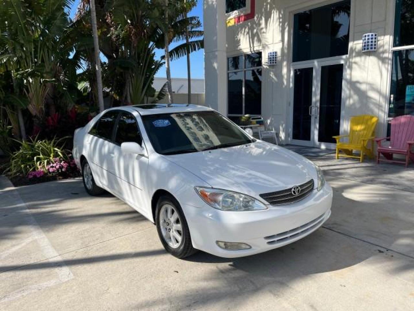 2004 Super White /Stone Toyota Camry XLE LOW MILES 75,074 (4T1BE32K14U) with an 2.4L DOHC MPFI Vvti 16-Valve 4-Cyl Engine engine, Automatic transmission, located at 4701 North Dixie Hwy, Pompano Beach, FL, 33064, (954) 422-2889, 26.240938, -80.123474 - 2004 TOYOTA CAMRY LE ROAD READY 2.4L I4 VIN: 4T1BE32K14U362181 NO ACCIDENTS SEDAN 4 DR WOOD TRIM XLE NO RECALLS 32 MPG 2.4L I4 F DOHC 16V POWER SUNROOF FLORIDA OWNER GASOLINE POWER MIRRORS LOW MILES 75,074 FRONT WHEEL DRIVE POWER LEATHER SEATS 23 SERVICE RECORDS Approach Lights Cruise Control FWD Fr - Photo#1