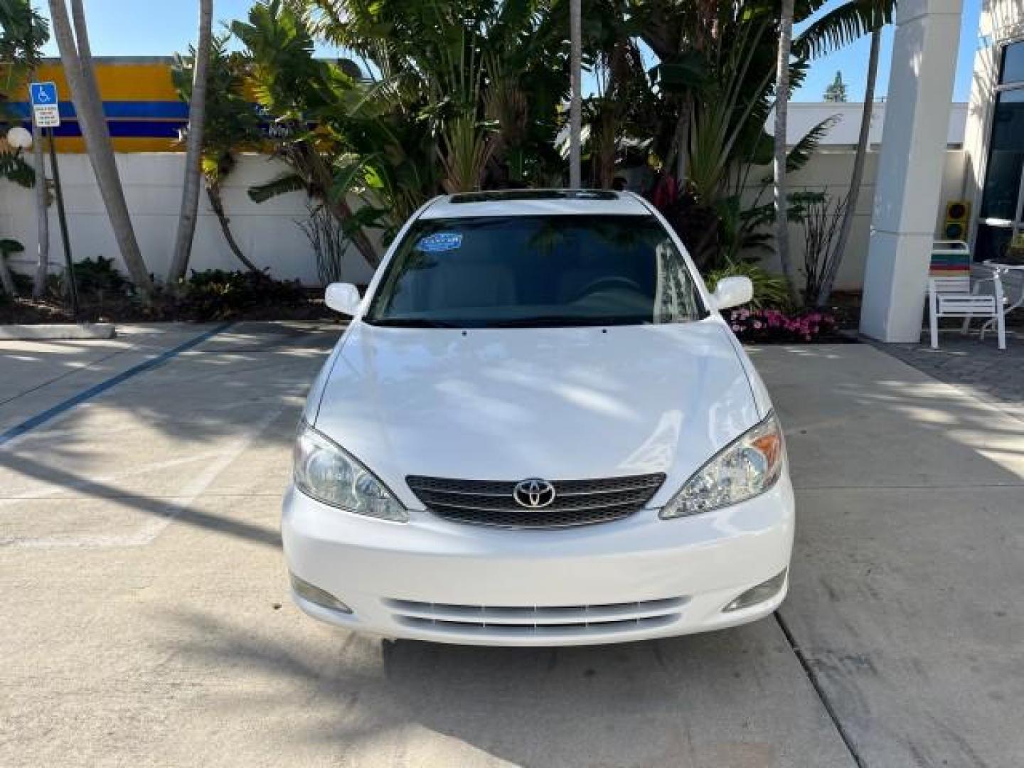 2004 Super White /Stone Toyota Camry XLE LOW MILES 75,074 (4T1BE32K14U) with an 2.4L DOHC MPFI Vvti 16-Valve 4-Cyl Engine engine, Automatic transmission, located at 4701 North Dixie Hwy, Pompano Beach, FL, 33064, (954) 422-2889, 26.240938, -80.123474 - 2004 TOYOTA CAMRY LE ROAD READY 2.4L I4 VIN: 4T1BE32K14U362181 NO ACCIDENTS SEDAN 4 DR WOOD TRIM XLE NO RECALLS 32 MPG 2.4L I4 F DOHC 16V POWER SUNROOF FLORIDA OWNER GASOLINE POWER MIRRORS LOW MILES 75,074 FRONT WHEEL DRIVE POWER LEATHER SEATS 23 SERVICE RECORDS Approach Lights Cruise Control FWD Fr - Photo#2