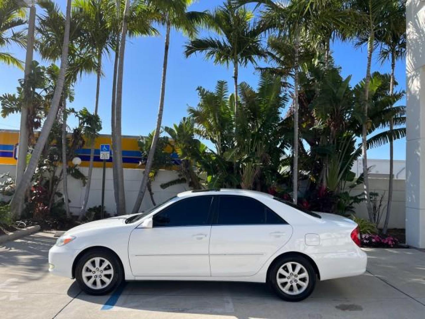 2004 Super White /Stone Toyota Camry XLE LOW MILES 75,074 (4T1BE32K14U) with an 2.4L DOHC MPFI Vvti 16-Valve 4-Cyl Engine engine, Automatic transmission, located at 4701 North Dixie Hwy, Pompano Beach, FL, 33064, (954) 422-2889, 26.240938, -80.123474 - 2004 TOYOTA CAMRY LE ROAD READY 2.4L I4 VIN: 4T1BE32K14U362181 NO ACCIDENTS SEDAN 4 DR WOOD TRIM XLE NO RECALLS 32 MPG 2.4L I4 F DOHC 16V POWER SUNROOF FLORIDA OWNER GASOLINE POWER MIRRORS LOW MILES 75,074 FRONT WHEEL DRIVE POWER LEATHER SEATS 23 SERVICE RECORDS Approach Lights Cruise Control FWD Fr - Photo#4