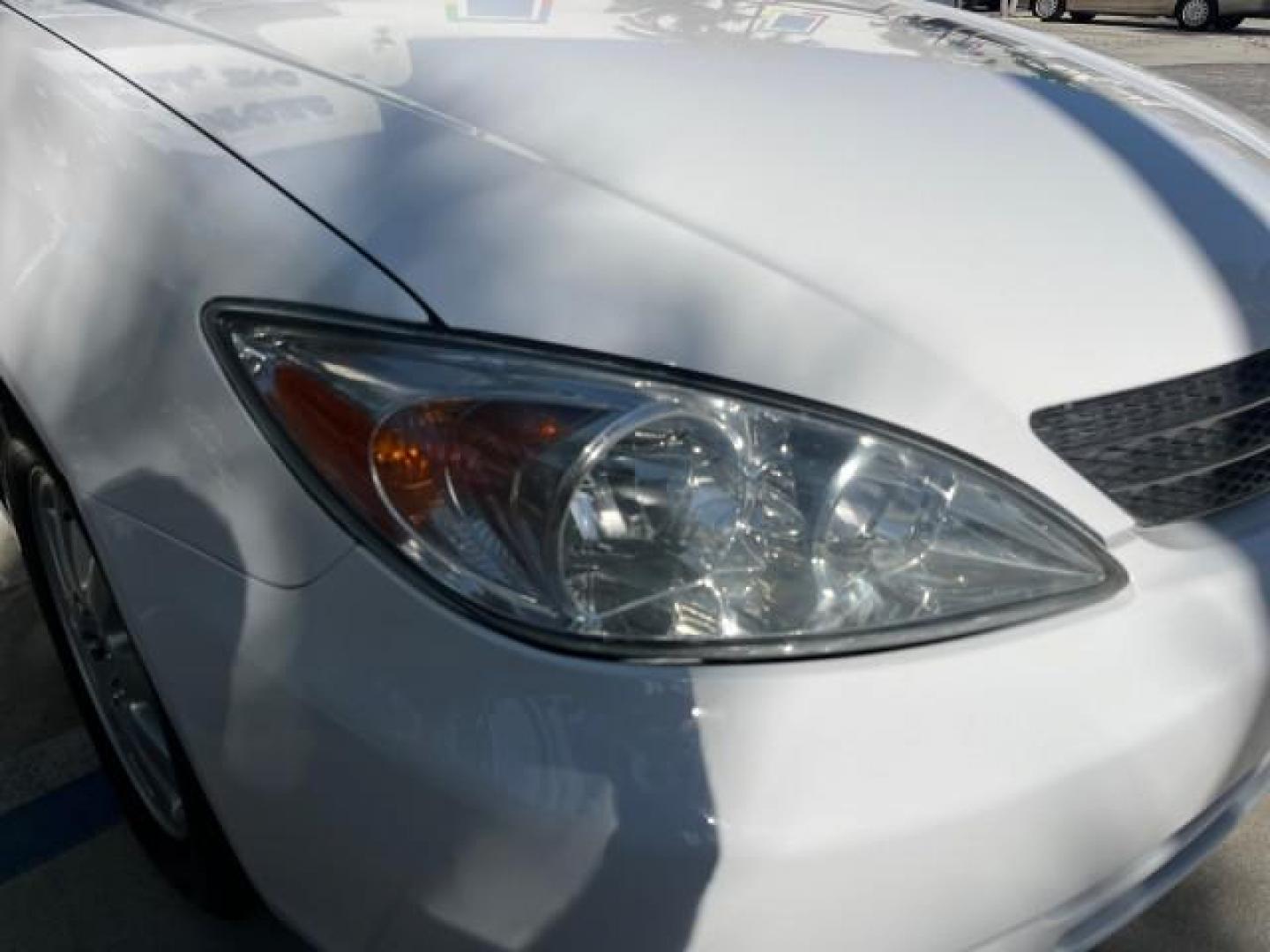 2004 Super White /Stone Toyota Camry XLE LOW MILES 75,074 (4T1BE32K14U) with an 2.4L DOHC MPFI Vvti 16-Valve 4-Cyl Engine engine, Automatic transmission, located at 4701 North Dixie Hwy, Pompano Beach, FL, 33064, (954) 422-2889, 26.240938, -80.123474 - 2004 TOYOTA CAMRY LE ROAD READY 2.4L I4 VIN: 4T1BE32K14U362181 NO ACCIDENTS SEDAN 4 DR WOOD TRIM XLE NO RECALLS 32 MPG 2.4L I4 F DOHC 16V POWER SUNROOF FLORIDA OWNER GASOLINE POWER MIRRORS LOW MILES 75,074 FRONT WHEEL DRIVE POWER LEATHER SEATS 23 SERVICE RECORDS Approach Lights Cruise Control FWD Fr - Photo#83