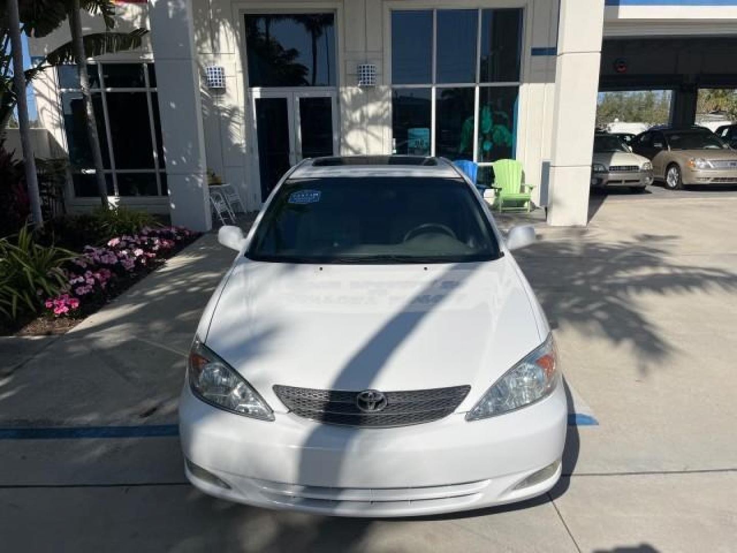 2004 Super White /Stone Toyota Camry XLE LOW MILES 75,074 (4T1BE32K14U) with an 2.4L DOHC MPFI Vvti 16-Valve 4-Cyl Engine engine, Automatic transmission, located at 4701 North Dixie Hwy, Pompano Beach, FL, 33064, (954) 422-2889, 26.240938, -80.123474 - 2004 TOYOTA CAMRY LE ROAD READY 2.4L I4 VIN: 4T1BE32K14U362181 NO ACCIDENTS SEDAN 4 DR WOOD TRIM XLE NO RECALLS 32 MPG 2.4L I4 F DOHC 16V POWER SUNROOF FLORIDA OWNER GASOLINE POWER MIRRORS LOW MILES 75,074 FRONT WHEEL DRIVE POWER LEATHER SEATS 23 SERVICE RECORDS Approach Lights Cruise Control FWD Fr - Photo#87