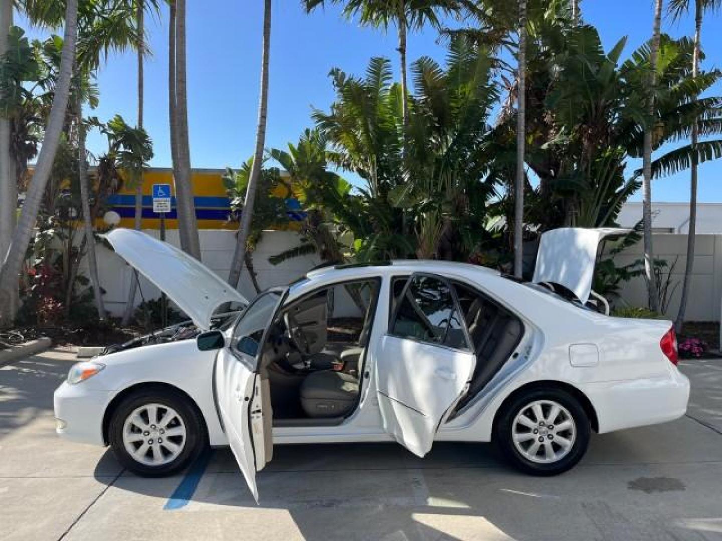 2004 Super White /Stone Toyota Camry XLE LOW MILES 75,074 (4T1BE32K14U) with an 2.4L DOHC MPFI Vvti 16-Valve 4-Cyl Engine engine, Automatic transmission, located at 4701 North Dixie Hwy, Pompano Beach, FL, 33064, (954) 422-2889, 26.240938, -80.123474 - 2004 TOYOTA CAMRY LE ROAD READY 2.4L I4 VIN: 4T1BE32K14U362181 NO ACCIDENTS SEDAN 4 DR WOOD TRIM XLE NO RECALLS 32 MPG 2.4L I4 F DOHC 16V POWER SUNROOF FLORIDA OWNER GASOLINE POWER MIRRORS LOW MILES 75,074 FRONT WHEEL DRIVE POWER LEATHER SEATS 23 SERVICE RECORDS Approach Lights Cruise Control FWD Fr - Photo#8