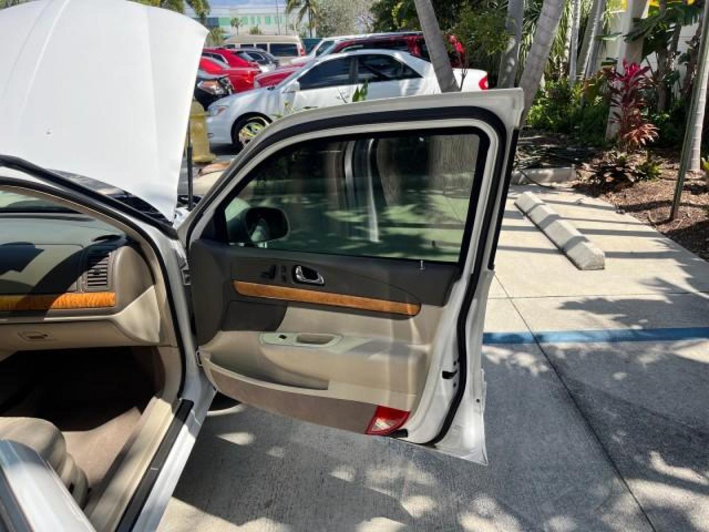 2001 White Pearlescent Metallic /Light Parchment Lincoln Continental 1 FL LOW MILES 65,765 (1LNHM97V51Y) with an 4.6L DOHC 32-Valve V8 Intech Engine engine, Automatic transmission, located at 4701 North Dixie Hwy, Pompano Beach, FL, 33064, (954) 422-2889, 26.240938, -80.123474 - 2001 LINCOLN CONTINENTAL NEW $39,700 ROAD READY VIN: 1LNHM97V51Y736217 NO ACCIDENTS SEDAN 4 DR NO RECALLS 4,6L V8 4.6L V8 F DOHC 32V 1 OWNER FLORIDA GASOLINE POWER MIRRORS 30 SERVICE RECORDS FRONT WHEEL DRIVE POWER LEATHER SEATS LOW MILES 65,765 Adjustable Lumbar Support Air Suspension Alloy Wheels - Photo#11